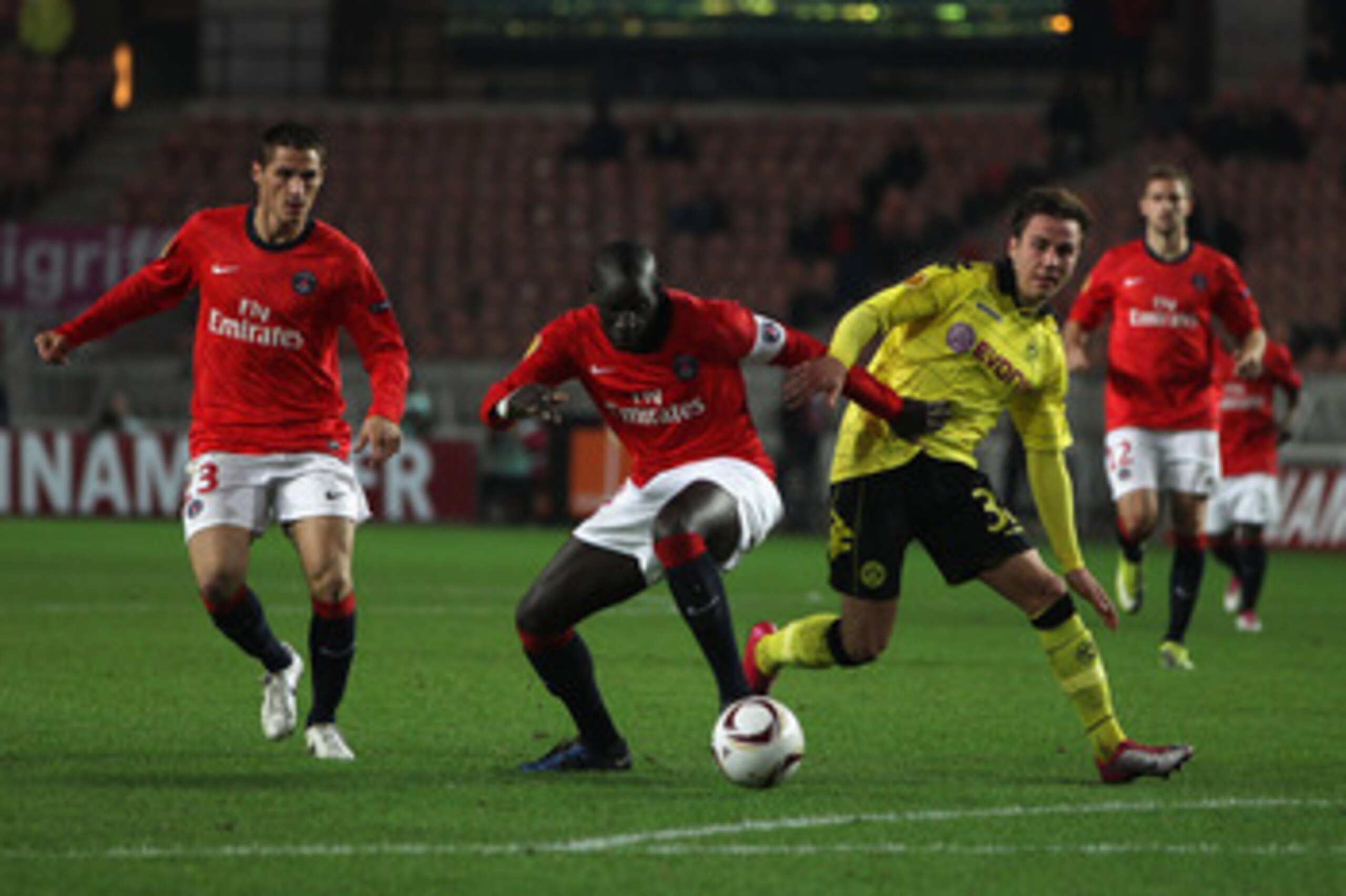 PARIS - NOVEMBER 04:  Mario Gotze (r) of Borussia challenged by Zoumana Camara of PSG during the UEFA Europa League Group J match between Paris Saint Germain and Borussia Dortmund at the Parc des Princes on November 4, 2010 in Paris, France.  (Photo by Mi