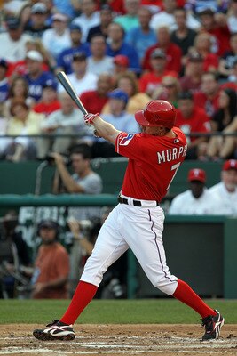ARLINGTON, TX - MAY 07:  David Murphy #7 of the Texas Rangers hits a solo homerun against the New York Yankees at Rangers Ballpark in Arlington on May 7, 2011 in Arlington, Texas.  (Photo by Ronald Martinez/Getty Images)