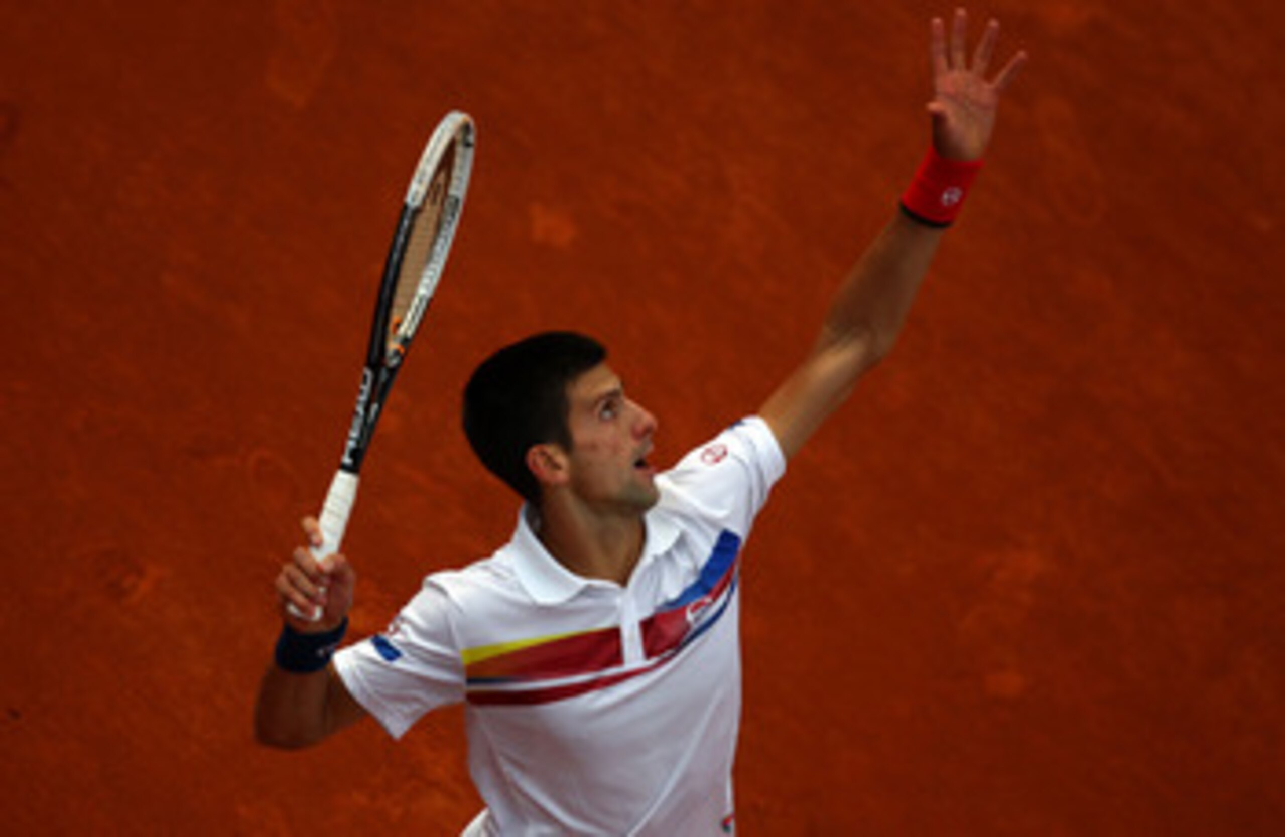 PARIS, FRANCE - MAY 29:  Novak Djokovic of Serbia celebrates matchpoint during the men's singles round four match between Richard Gasquet of France and Novak Djokovic of Serbia on day eight of the French Open at Roland Garros on May 29, 2011 in Paris, Fra