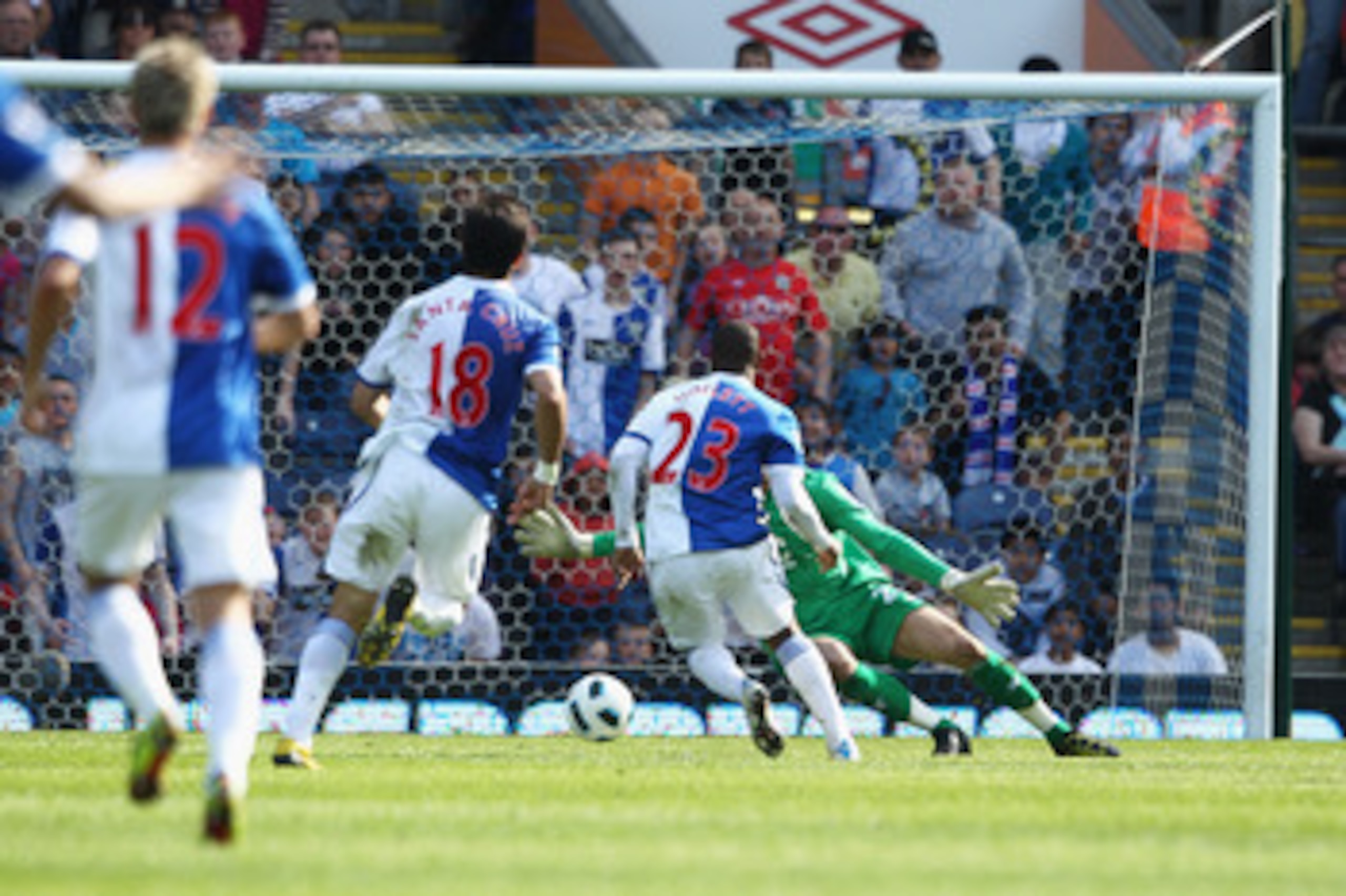 BLACKBURN, ENGLAND - APRIL 09:  Junior Hoilett of Blackburn goes past Ben Foster of Birmingham to score his teams first goal of the game during the Barclays Premier League match between Blackburn Rovers and Birmingham City at Ewood park on April 9, 2011 i