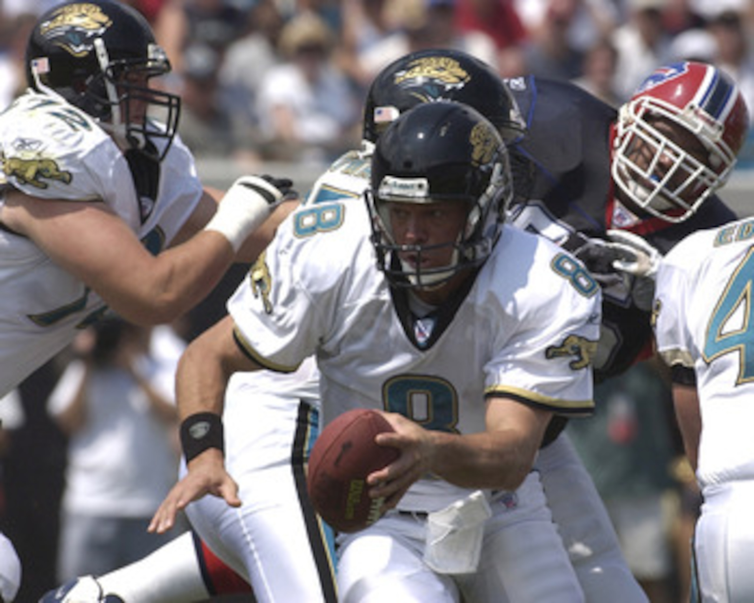 Jacksonville Jaguars quarterback Mark Brunell scrambles against the Buffalo Bills pass rush  Sunday, September 14, 2003 at Alltel Stadium, Jacksonville.  The Bills defeated the Jaguars 38 - 17.  (Photo by Al Messerschmidt/Getty Images)
