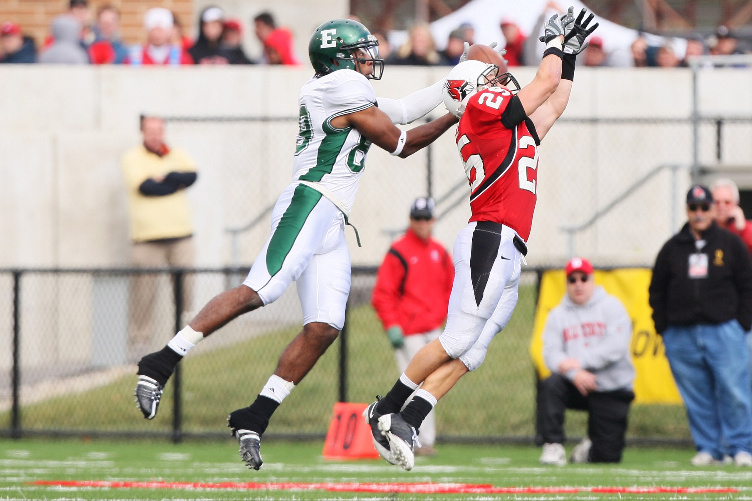 MUNCIE, IN - OCTOBER 25: Wide receiver Josh LeDuc #89 of the Eastern Michigan Eagles snares a pass reception from defensive back Sean Baker #25 of the Ball State Cardinals on October 25, 2008 at Scheumann Stadium in Muncie, Indiana.  (Photo by Jamie Sabau