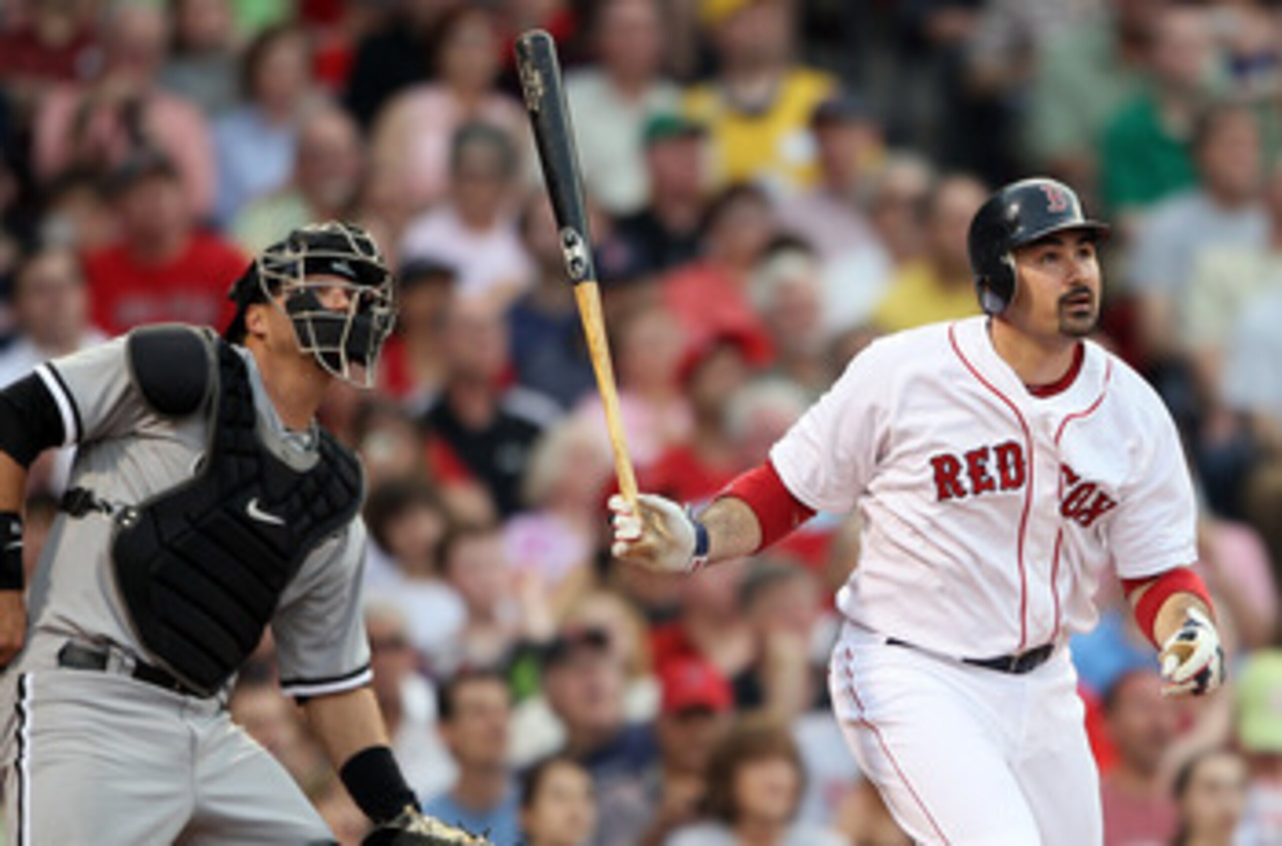 BOSTON, MA - MAY 30:  Adrian Gonzalez #28 of the Boston Red Sox and A.J. Pierzynski #12 of the Chicago White Sox watch Gonzalez's solo home run in the first inning on May 30, 2011 at Fenway Park in Boston, Massachusetts.  (Photo by Elsa/Getty Images)