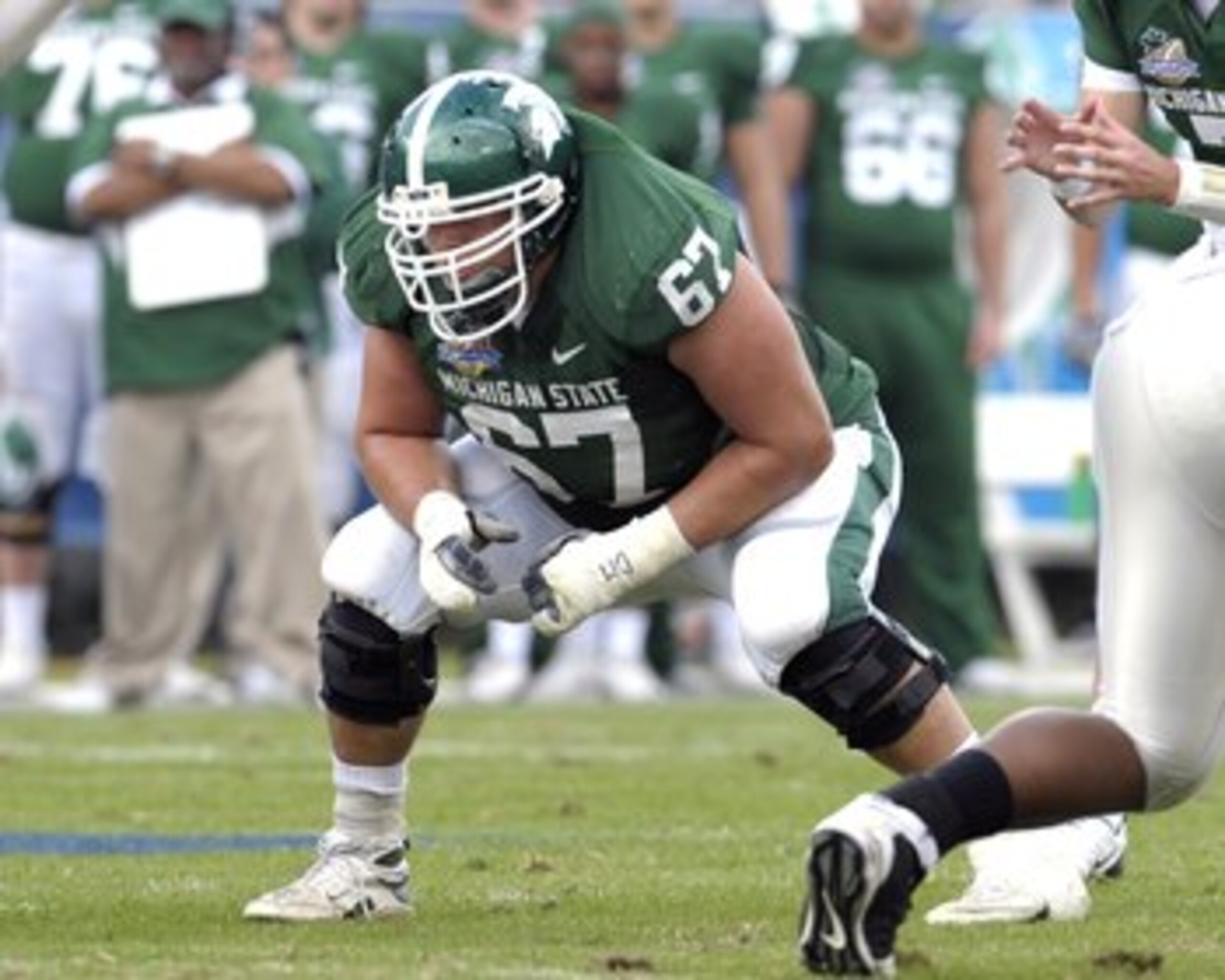 ORLANDO, FL - JANUARY 1: Guard Joel Foreman #67 of the Michigan State Spartans sets to block against the Georgia Bulldogs at the 2009 Capital One Bowl at the Citrus Bowl on January 1, 2009 in Orlando, Florida.  (Photo by Al Messerschmidt/Getty Images)