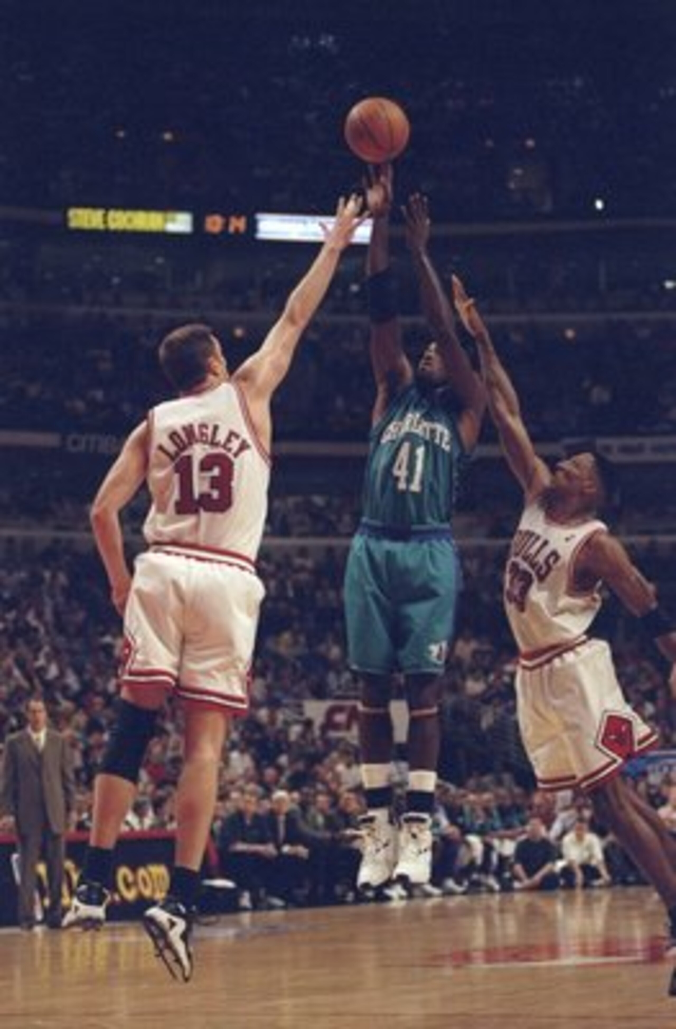 13 May, 1998:  Luc Longley #13 and Scottie Pippen #31 of the Chicago Bulls go up against Glen Rice #41 of the Charlotte Hornets for the ball during the NBA Eastern Conference Finals at the United Center in Chicago, Illinois.  The Bulls defeated the Hornet