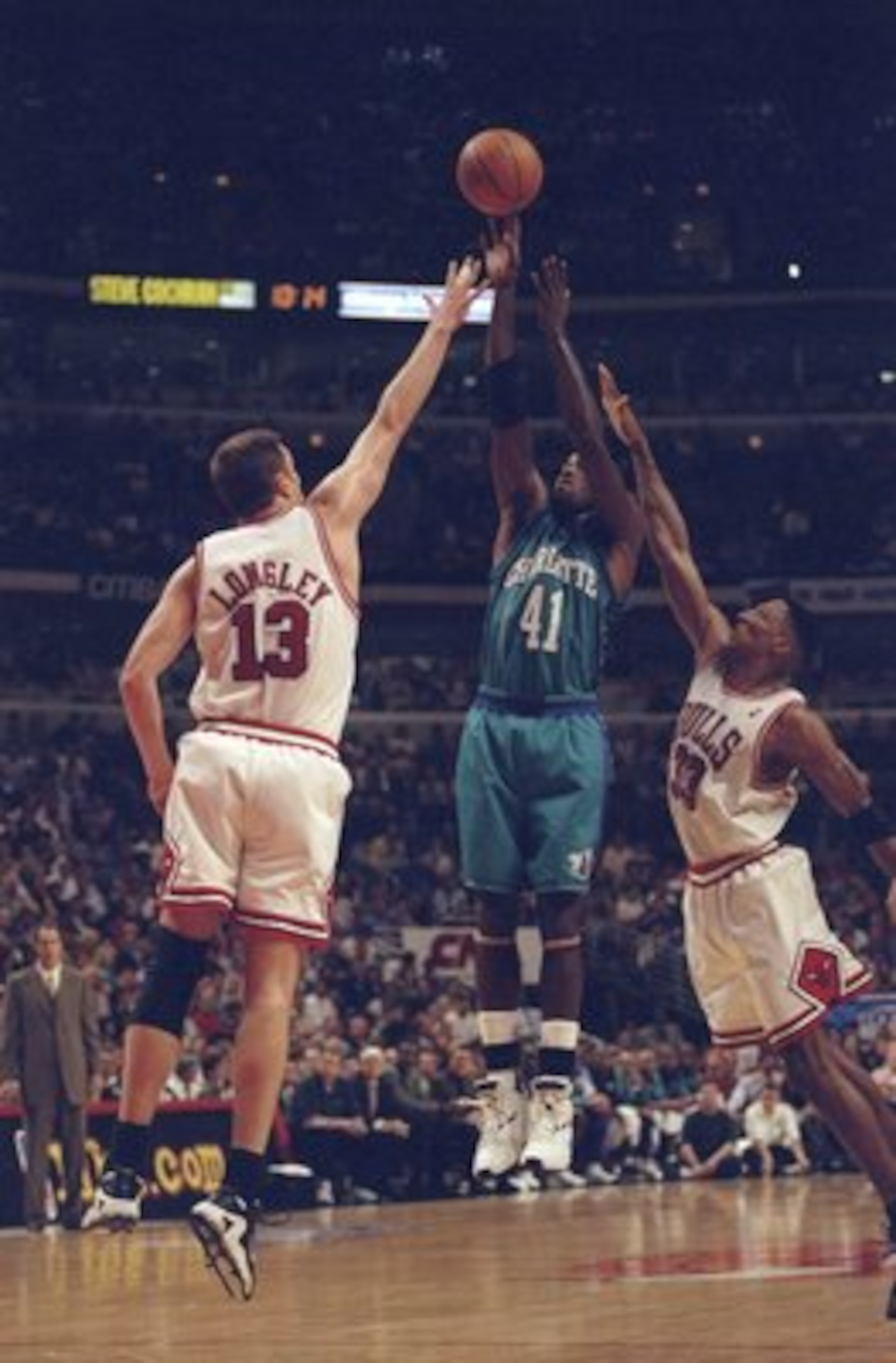 13 May, 1998:  Luc Longley #13 and Scottie Pippen #31 of the Chicago Bulls go up against Glen Rice #41 of the Charlotte Hornets for the ball during the NBA Eastern Conference Finals at the United Center in Chicago, Illinois.  The Bulls defeated the Hornet