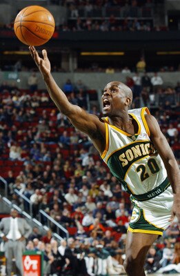 SEATTLE - FEBRUARY 11:  Gary Payton #20 of the Seattle Sonics puts up a shot during the game against the Boston Celtics at Key Arena on February 11, 2003 in Seattle, Washington.  The Celtics won 82-76.  NOTE TO USER: User expressly acknowledges and agrees
