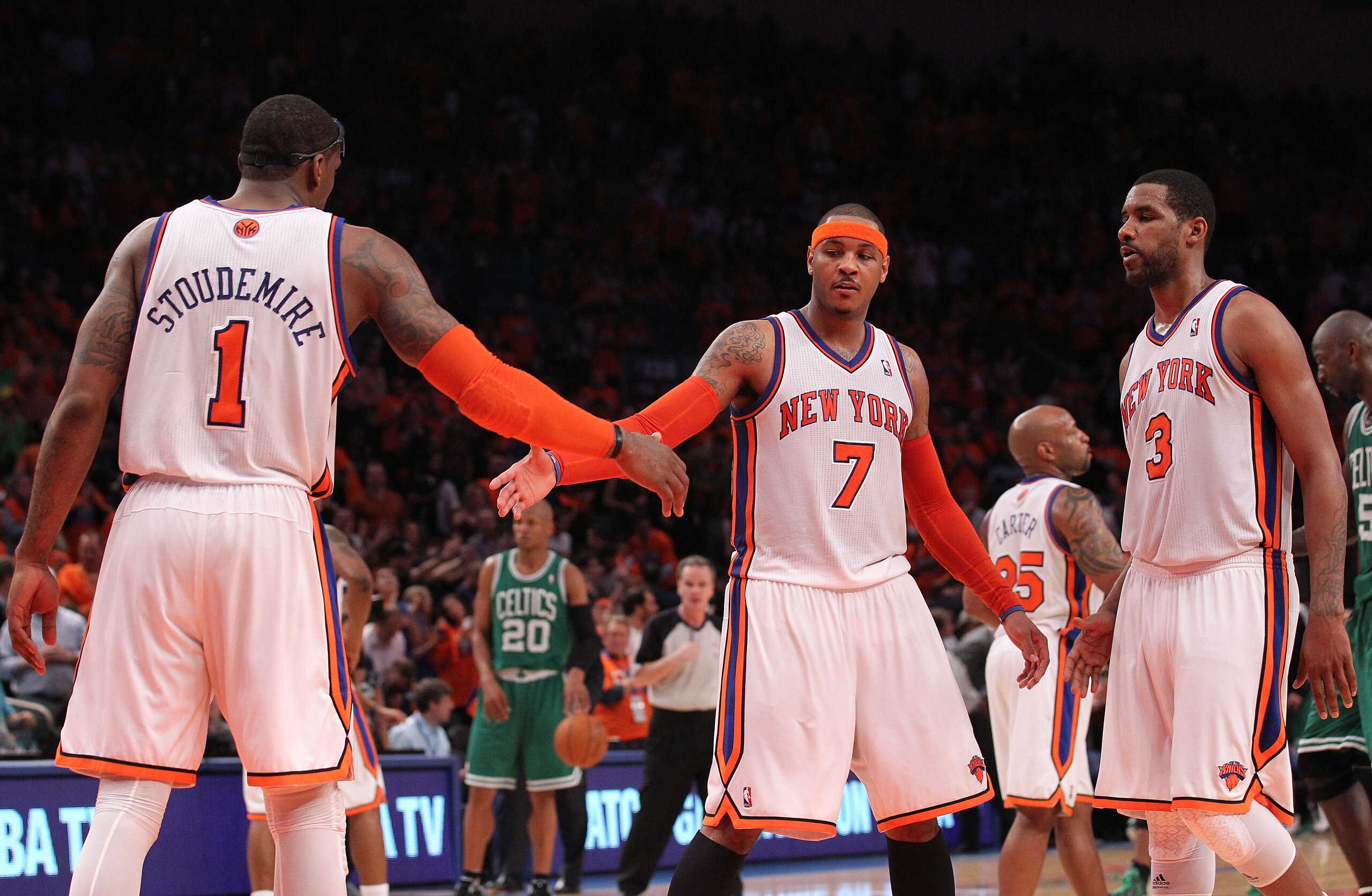 NEW YORK, NY - APRIL 24:  (L-R) Amar'e Stoudemire #1, Carmelo Anthony #7 and Shawne Williams #3 of the New York Knicks celebrate a play against the Boston Celtics in Game Four of the Eastern Conference Quarterfinals during the 2011 NBA Playoffs on April 2