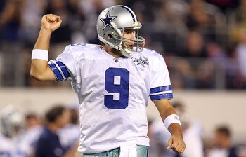 ARLINGTON, TX - OCTOBER 25:  Quarterback Tony Romo #9 of the Dallas Cowboys celebrates a touchdown by Jason Witten against the New York Giants in the first quarter at Cowboys Stadium on October 25, 2010 in Arlington, Texas.  (Photo by Ronald Martinez/Gett