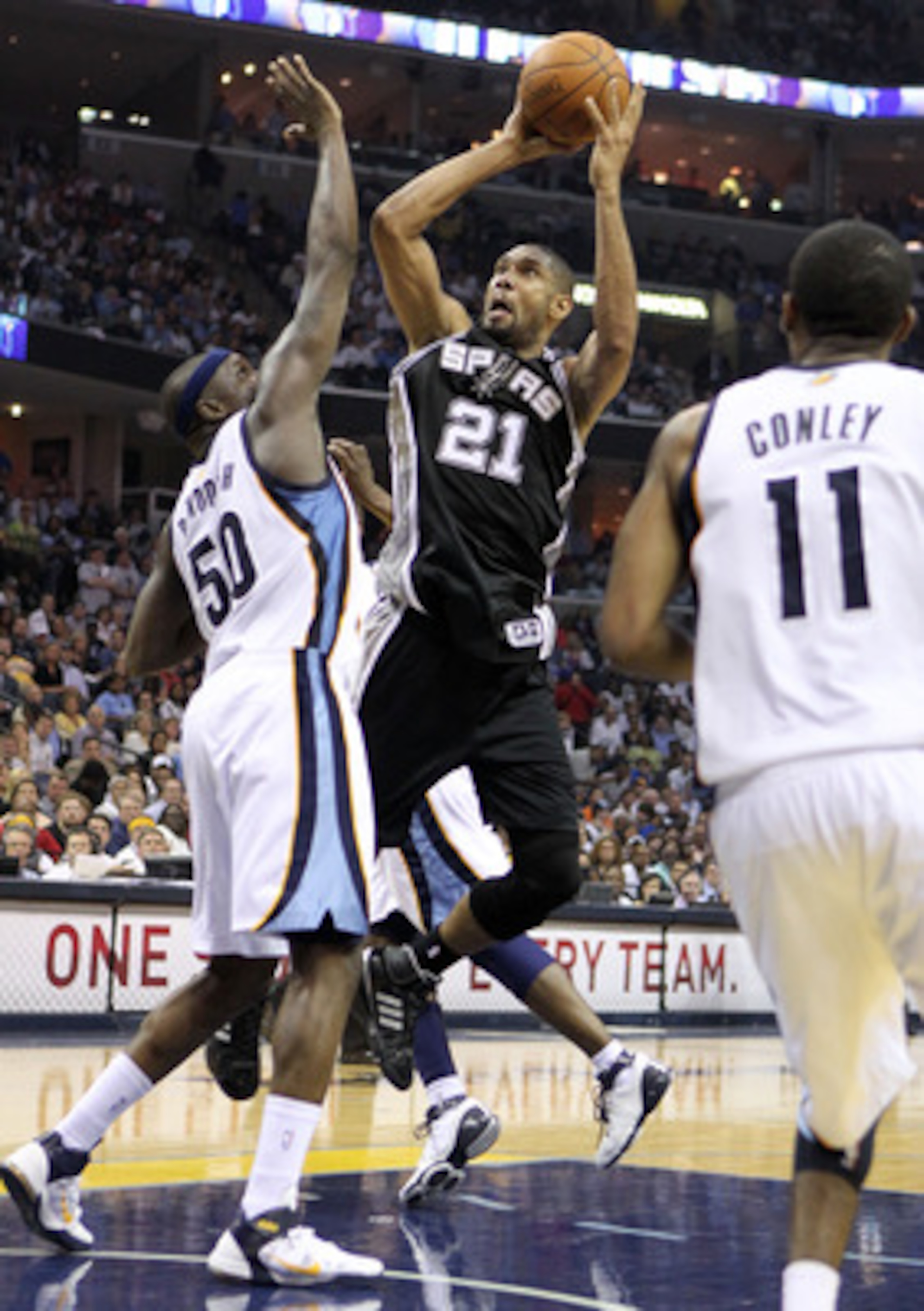 MEMPHIS, TN - APRIL 25:  Tim Duncan #21 of the San Antonio Spurs shoots the ball while defended by Zach Randolph #50 of the Memphis Grizzlies in Game Four of the Western Conference Quarterfinals in the 2011 NBA Playoffs at FedExForum on April 25, 2011 in 