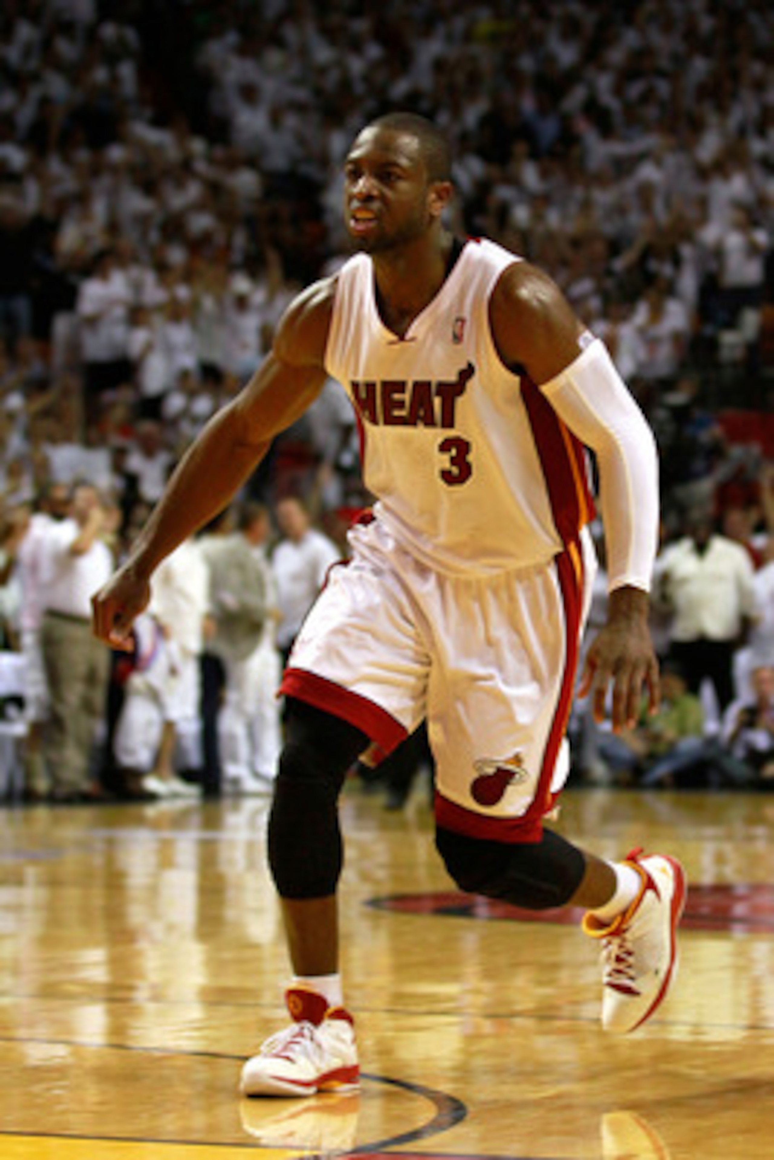 MIAMI, FL - MAY 24:  Dwyane Wade #3 of the Miami Heat reacts against the Chicago Bulls in Game Four of the Eastern Conference Finals during the 2011 NBA Playoffs on May 24, 2011 at American Airlines Arena in Miami, Florida. Recording artist Drake NOTE TO 