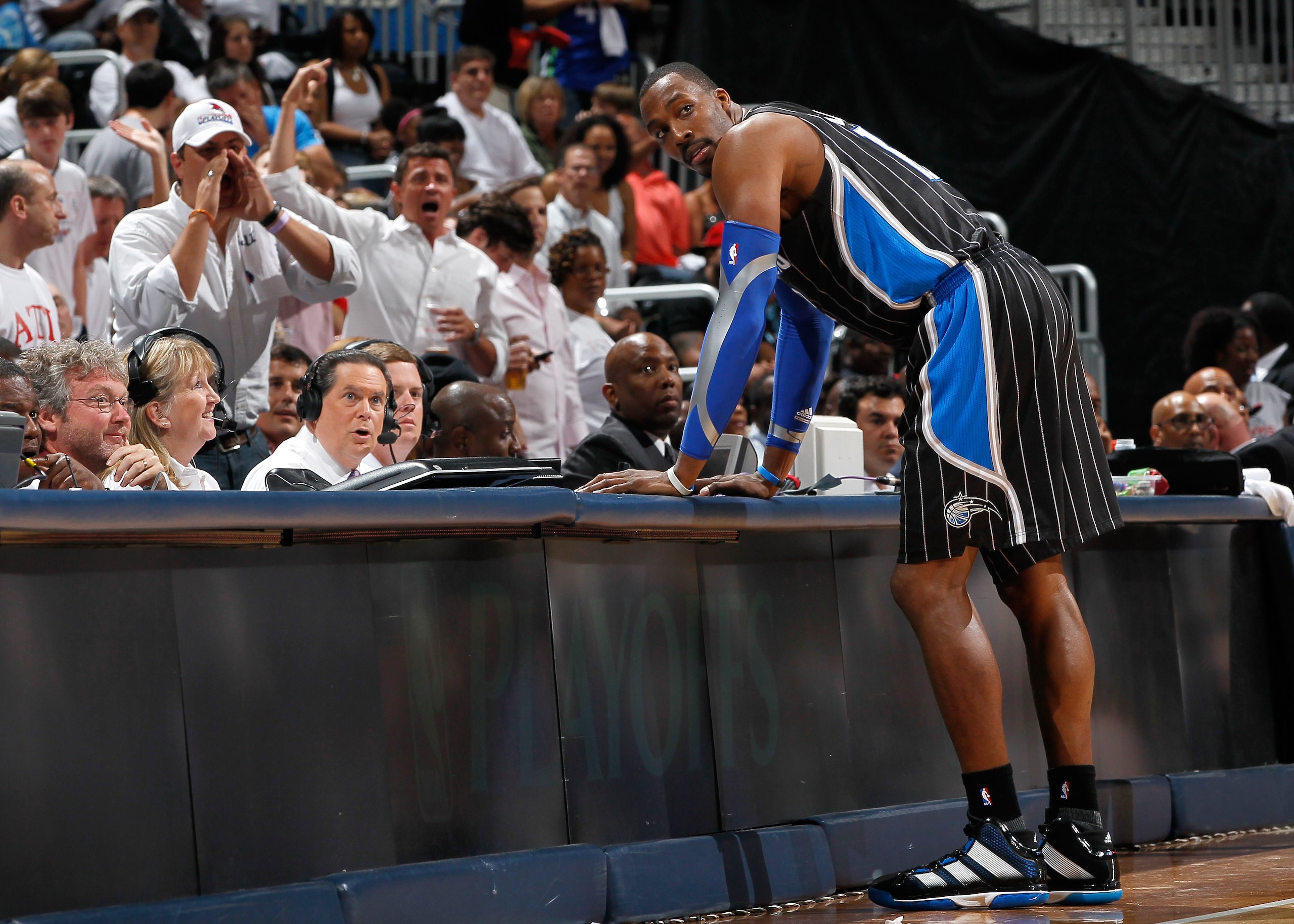 ATLANTA, GA - APRIL 28: Dwight Howard #12 of the Orlando Magic stands at the scorer's table after being earning a technical foul against Zaza Pachulia #27 of the Atlanta Hawks during Game Six of the Eastern Conference Quarterfinals in the 2011 NBA Playof ATLANTA, GA - APRIL 28: Dwight Howard #12 of the Orlando Magic stands at the scorer's table after being earning a technical foul against Zaza Pachulia #27 of the Atlanta Hawks during Game Six of the Eastern Conference Quarterfinals in the 2011 NBA Playof
