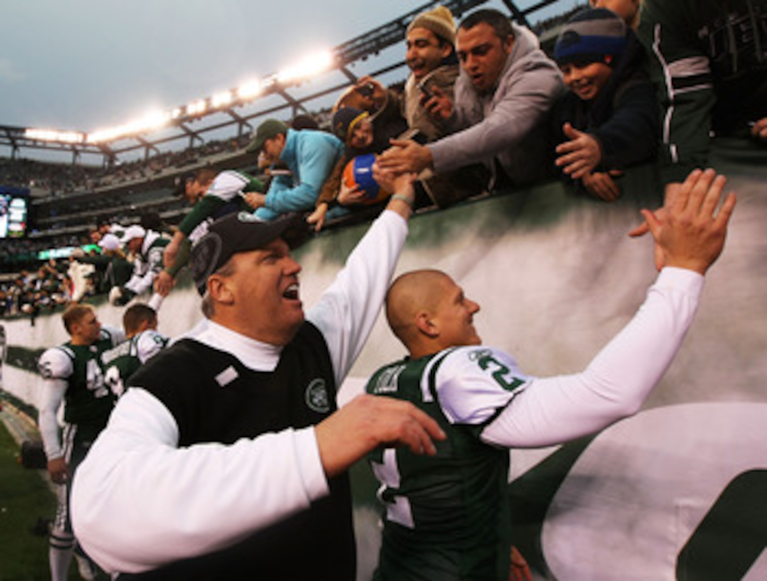 EAST RUTHERFORD, NJ - JANUARY 02:  Head coach Rex Ryan and Nick Folk #2 of the New York Jets celebrate with fans after they defeated the Buffalo Bills 38 to 7 at New Meadowlands Stadium on January 2, 2011 in East Rutherford, New Jersey.  (Photo by Al Bell