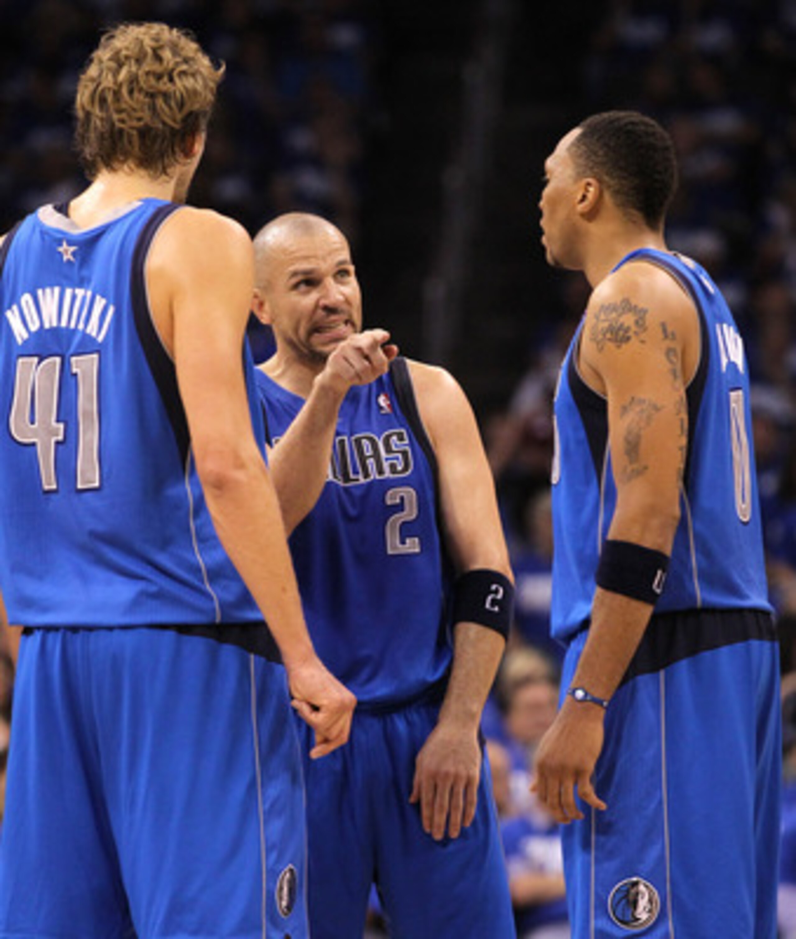 OKLAHOMA CITY, OK - MAY 21:  (C) Jason Kidd #2 of the Dallas Mavericks talks with teammates Dirk Nowitzki #41 and Shawn Marion #0 while taking on the Oklahoma City Thunder in Game Three of the Western Conference Finals during the 2011 NBA Playoffs at Okla