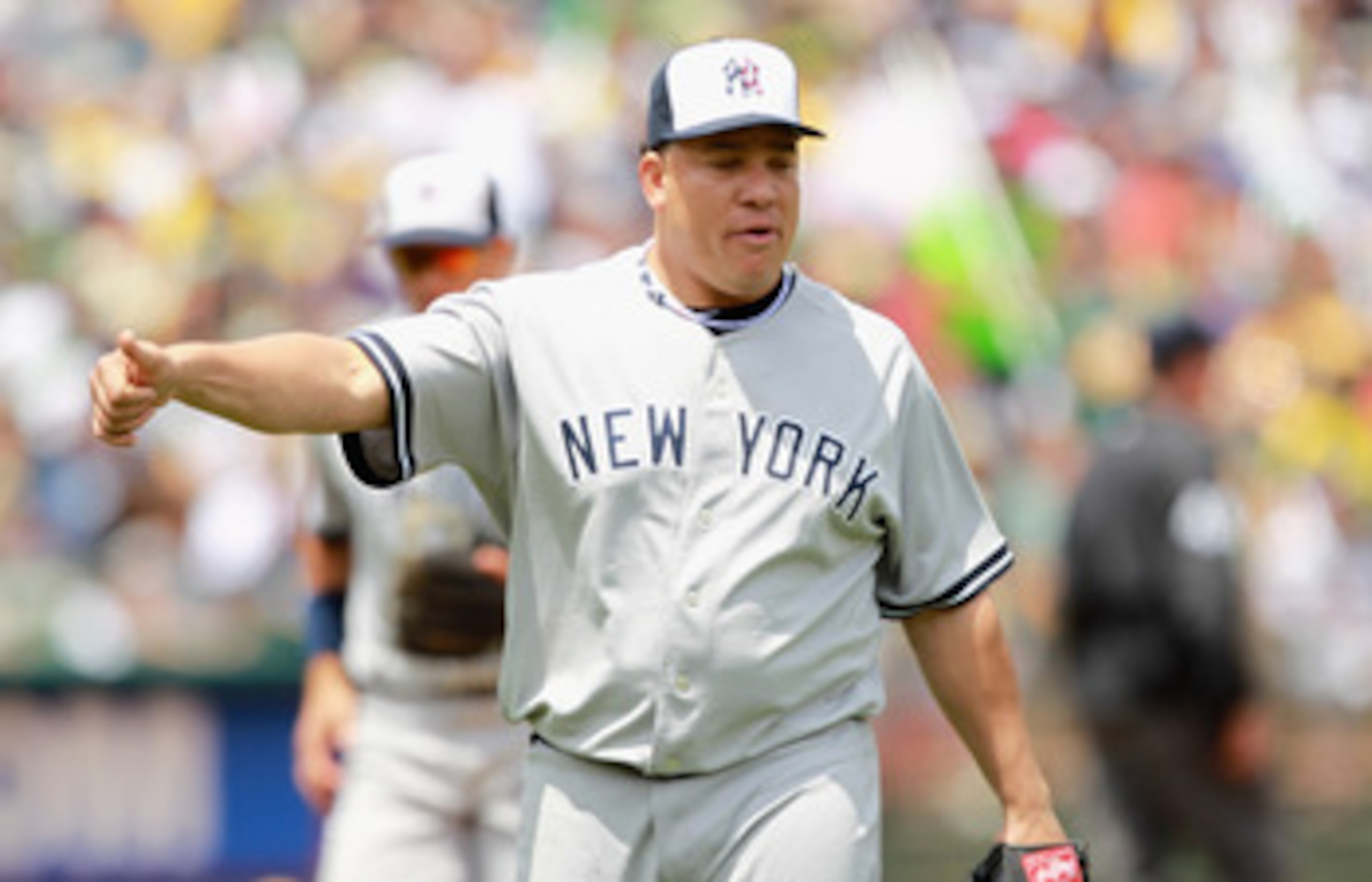 OAKLAND, CA - MAY 30:  Bartolo Colon #40 of the New York Yankees reacts after Alex Rodriguez #13 of the New York Yankees threw out Mark Ellis #14 of the Oakland Athletics in the second inning at Oakland-Alameda County Coliseum on May 30, 2011 in Oakland,