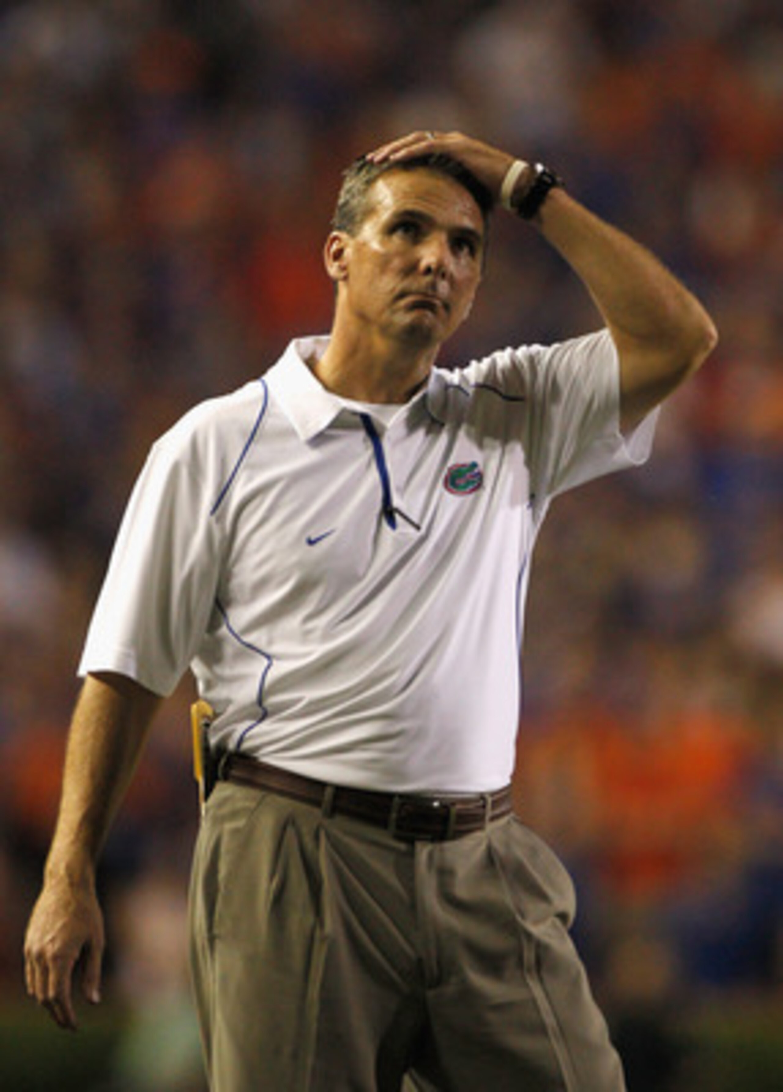 GAINESVILLE, FL - OCTOBER 09: Head coach Urban Meyer of the Florida Gators puts his hand on his head during the game against the Louisiana State University Tigers at Ben Hill Griffin Stadium on October 9, 2010 in Gainesville, Florida. (Photo by Sam Gree GAINESVILLE, FL - OCTOBER 09: Head coach Urban Meyer of the Florida Gators puts his hand on his head during the game against the Louisiana State University Tigers at Ben Hill Griffin Stadium on October 9, 2010 in Gainesville, Florida. (Photo by Sam Gree