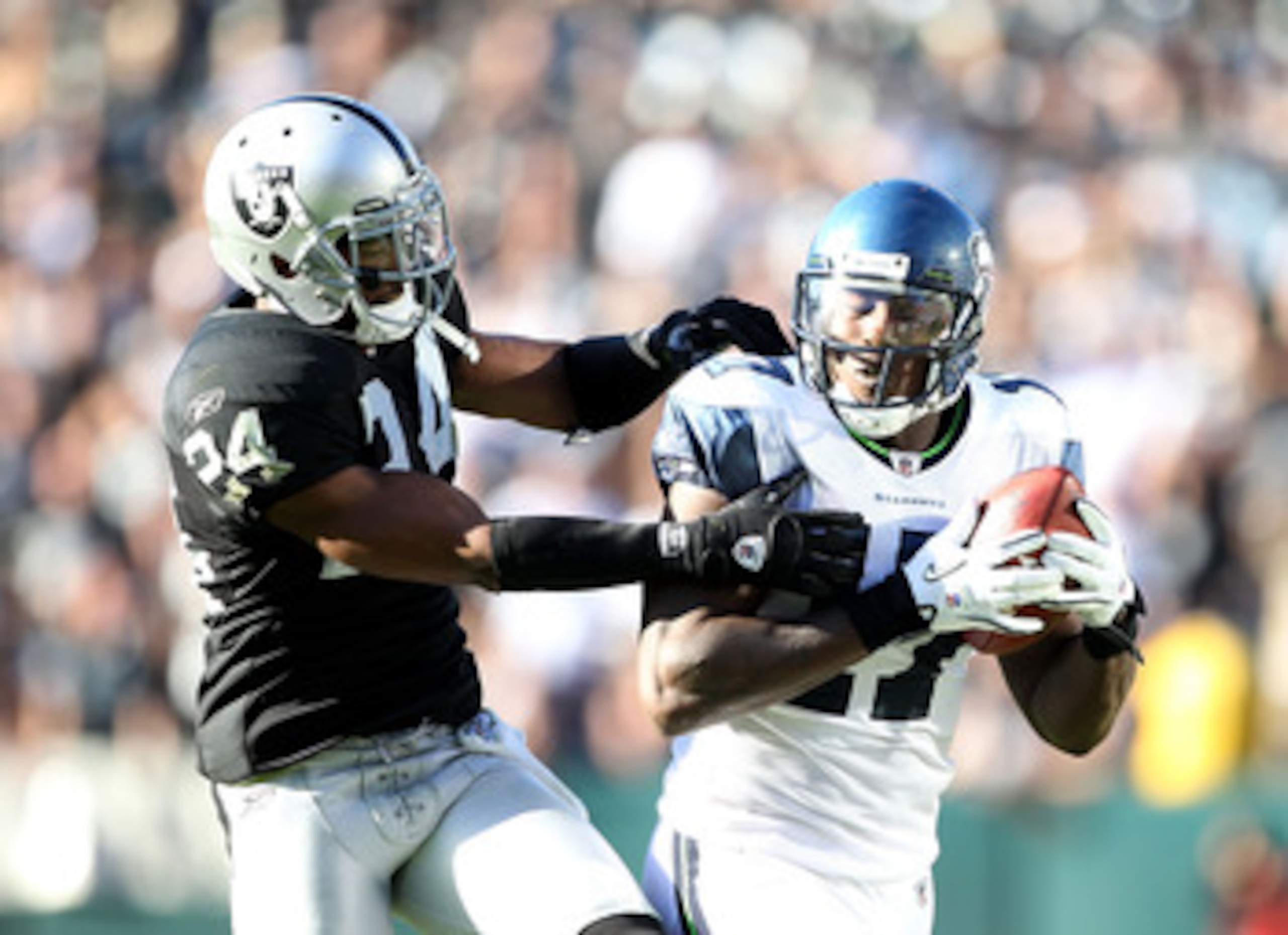 OAKLAND, CA - OCTOBER 31: Mike Williams #17 of the Seattle Seahawks catches the ball while defended by Michael Huff #24 of the Oakland Raiders at Oakland-Alameda County Coliseum on October 31, 2010 in Oakland, California. (Photo by Ezra Shaw/Getty Image OAKLAND, CA - OCTOBER 31: Mike Williams #17 of the Seattle Seahawks catches the ball while defended by Michael Huff #24 of the Oakland Raiders at Oakland-Alameda County Coliseum on October 31, 2010 in Oakland, California. (Photo by Ezra Shaw/Getty Image