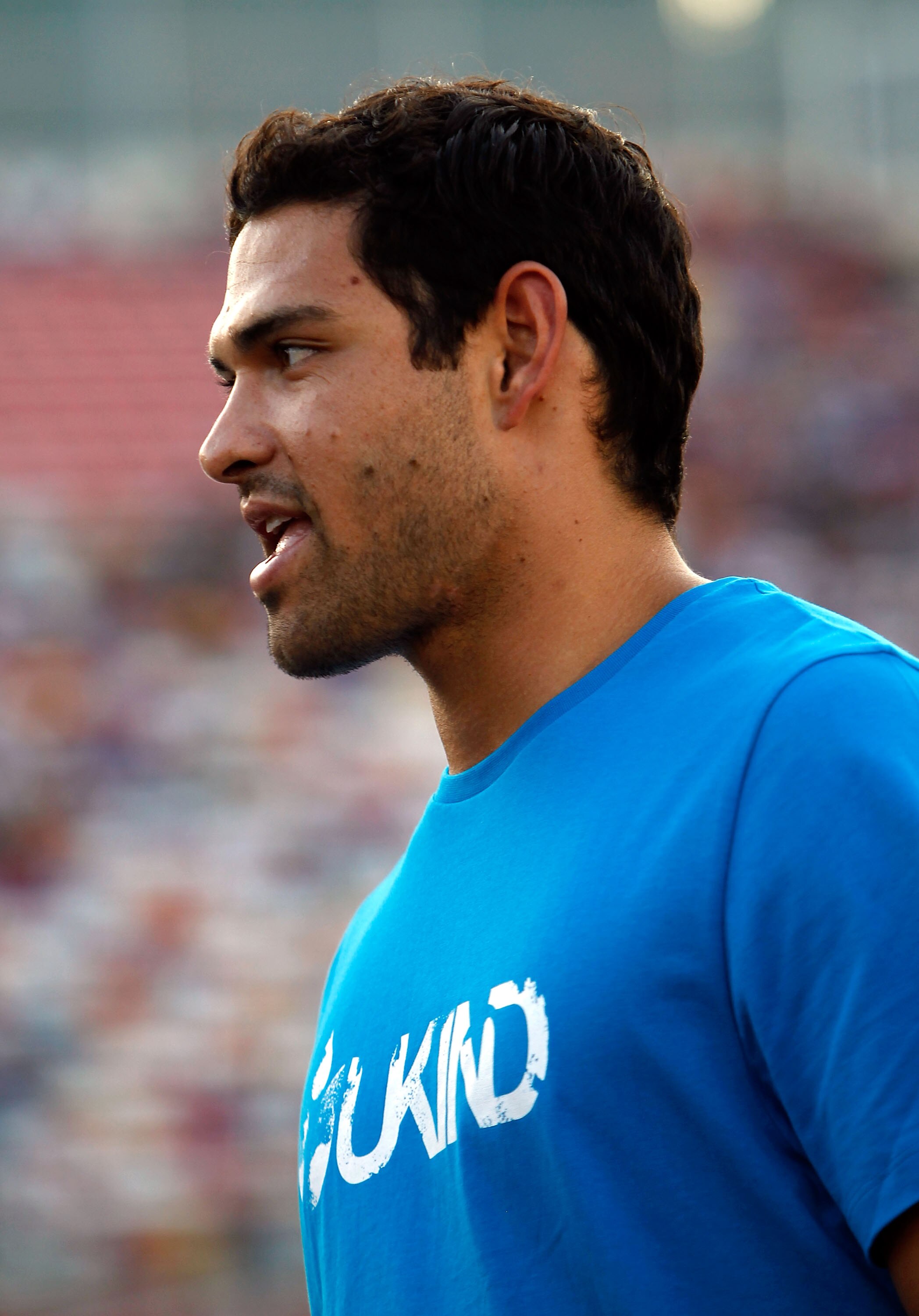 CHARLOTTE, NC - MAY 20:  New York Jets quarterback Mark Sanchez stands on the starting grid prior to the NASCAR Camping World Truck Series North Carolina Education Lottery 200 at Charlotte Motor Speedway on May 20, 2011 in Charlotte, North Carolina.  (Pho