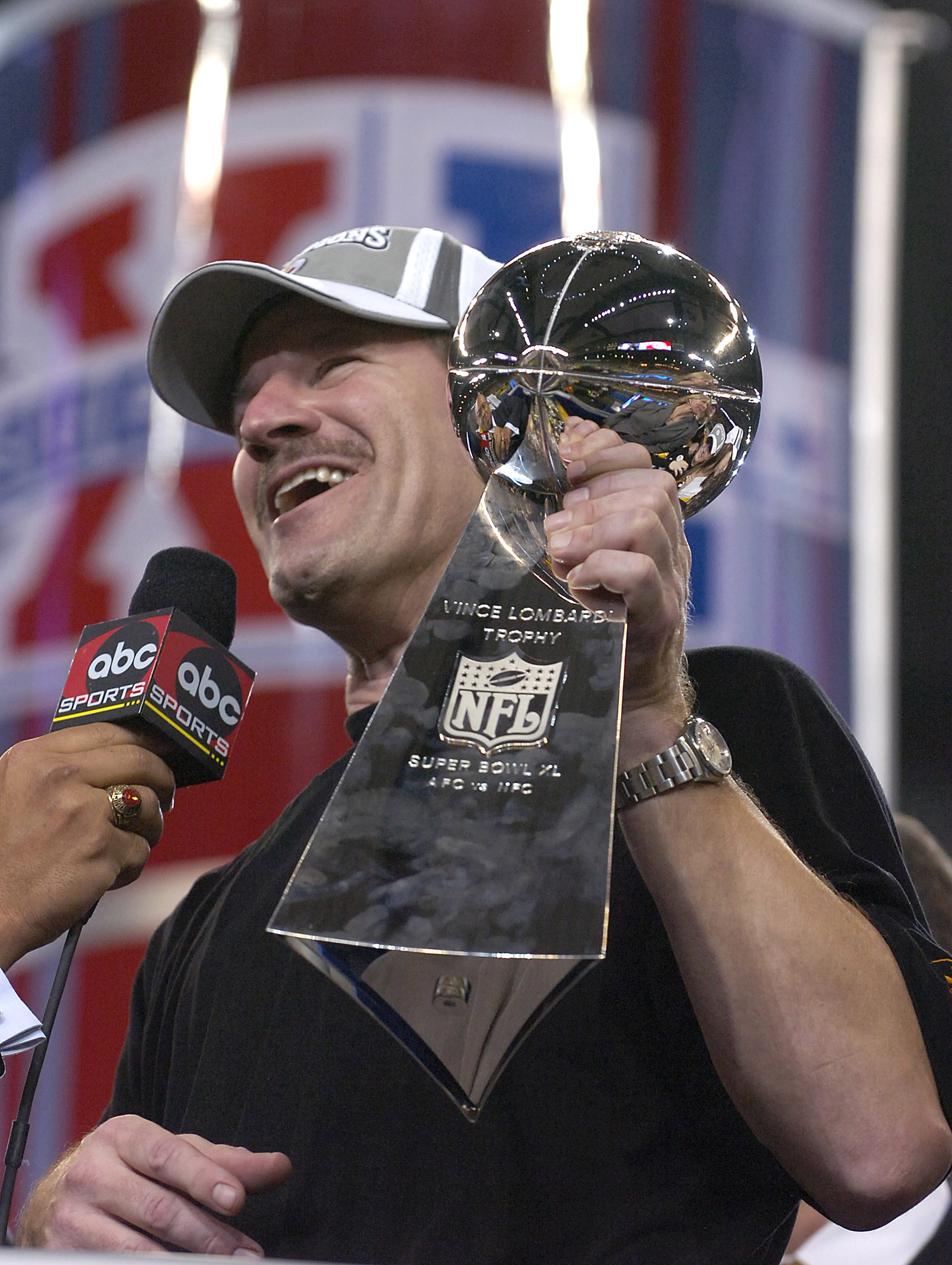 Steelers head coach Bill Cowher holds the Vince Lombardi trophy after the Steelers won Super Bowl XL between the Pittsburgh Steelers and Seattle Seahawks at Ford Field in Detroit, Michigan on February 5, 2006.  (Photo by Al Messerschmidt/Getty Images)