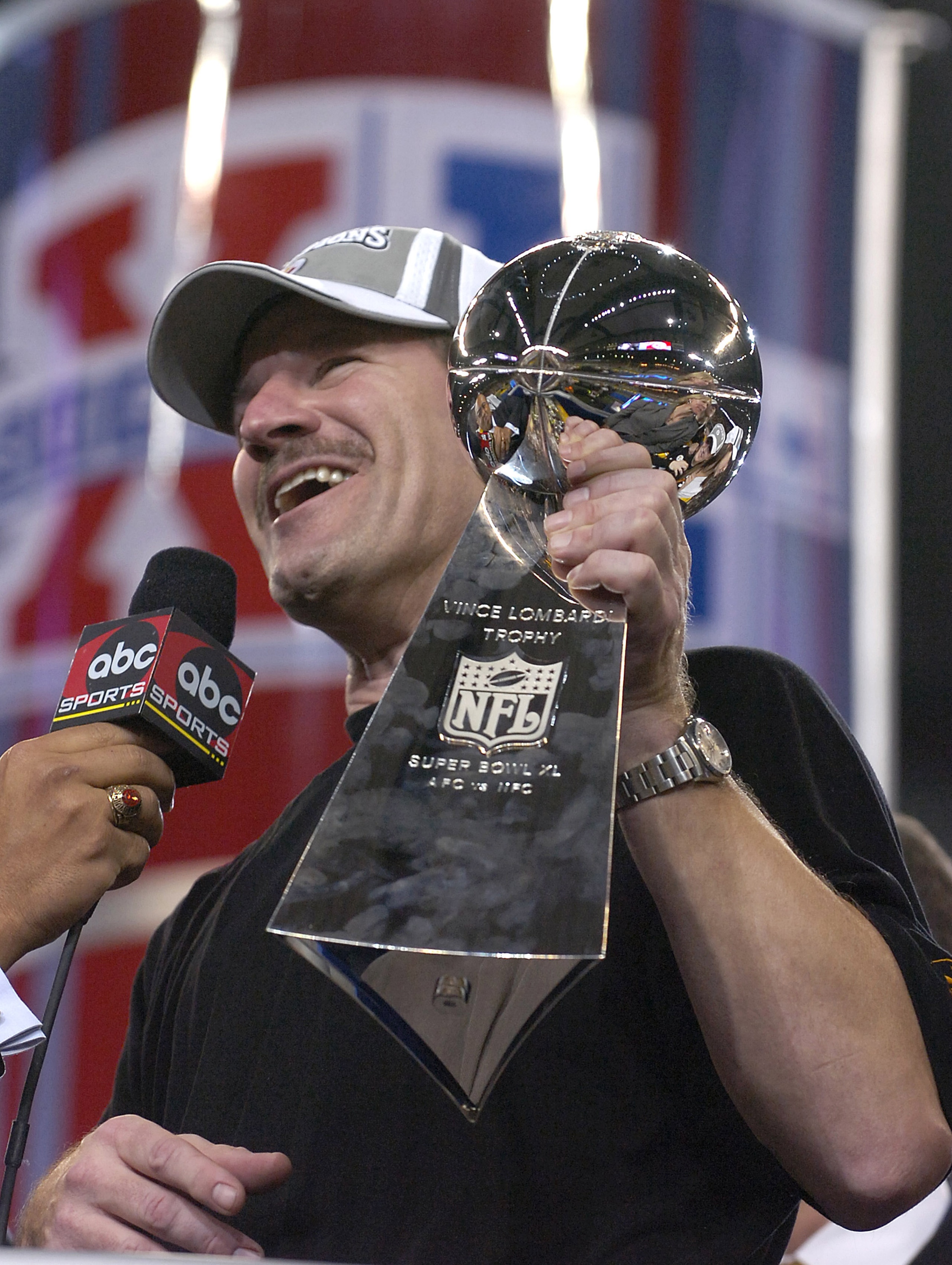 Steelers head coach Bill Cowher holds the Vince Lombardi trophy after the Steelers won Super Bowl XL between the Pittsburgh Steelers and Seattle Seahawks at Ford Field in Detroit, Michigan on February 5, 2006.  (Photo by Al Messerschmidt/Getty Images)