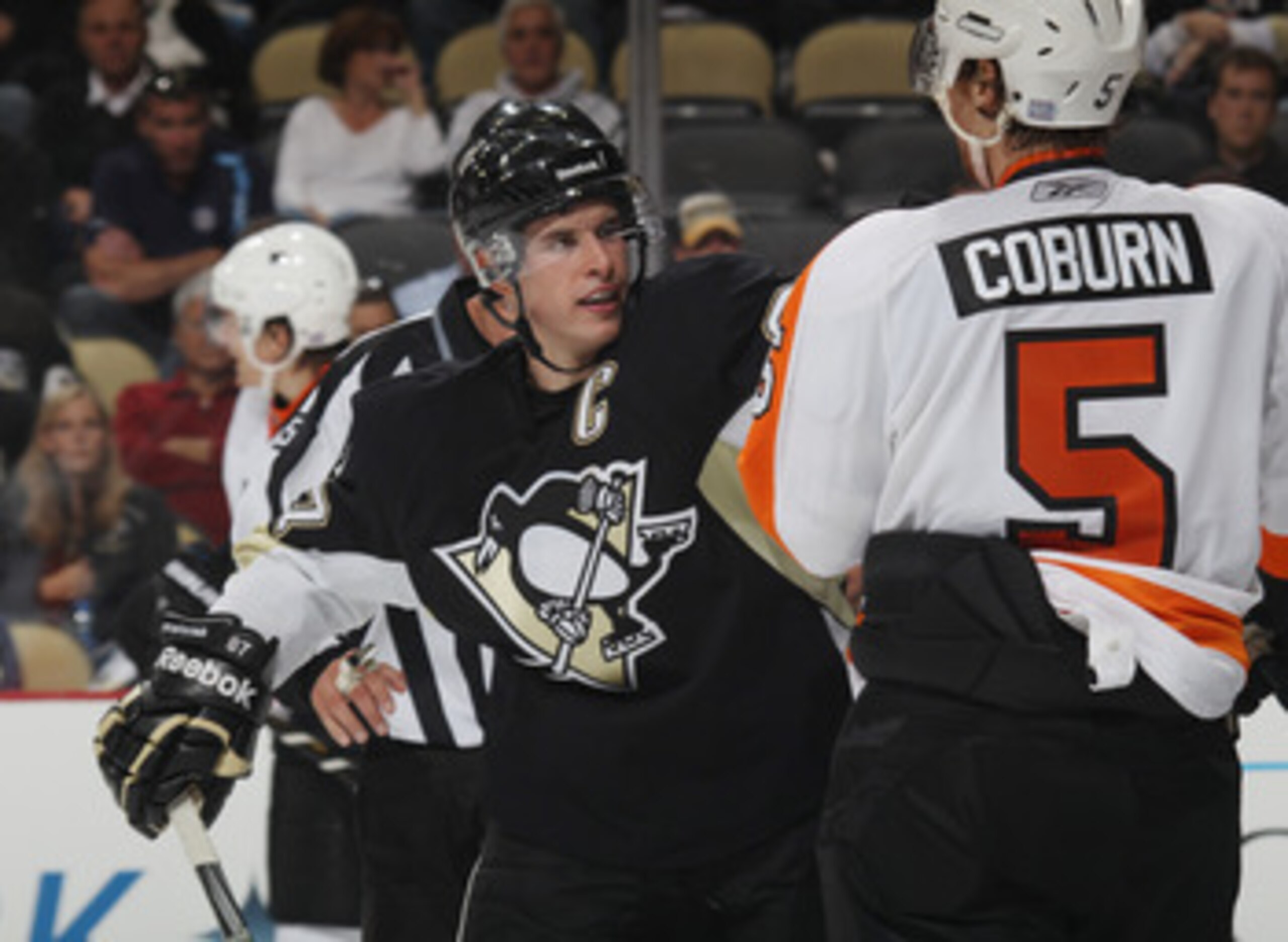 PITTSBURGH - OCTOBER 07: Sidney Crosby #87 of the Pittsburgh Penguins exchanges words with Braydon Coburn #5 of the Philadelphia Flyers at the Consol Energy Center on October 7, 2010 in Pittsburgh, Pennsylvania. (Photo by Bruce Bennett/Getty Images)