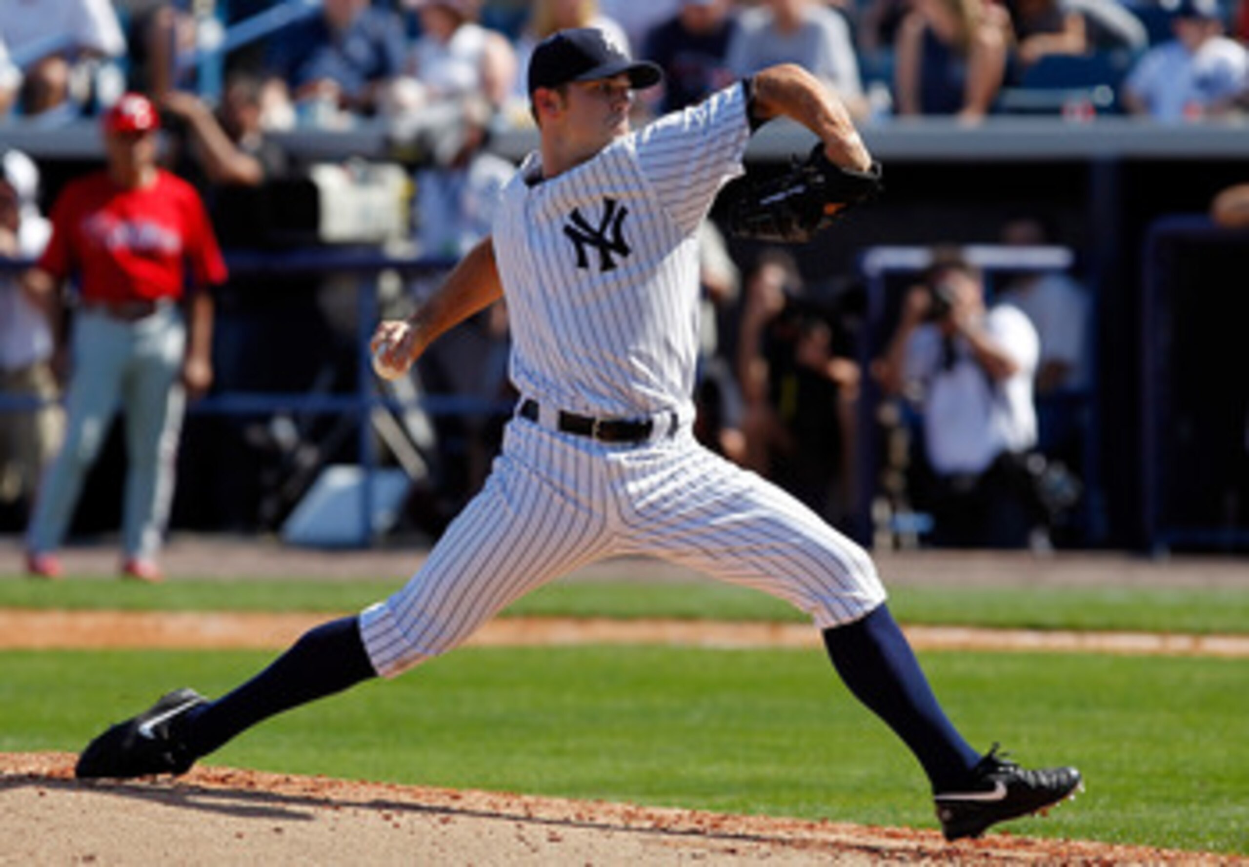 TAMPA, FL - FEBRUARY 26:  Pitcher David Robertson #30 of the New York Yankees pitches against the Philadelphia Phillies during a Grapefruit League Spring Training Game at George M. Steinbrenner Field on February 26, 2011 in Tampa, Florida.  (Photo by J. M