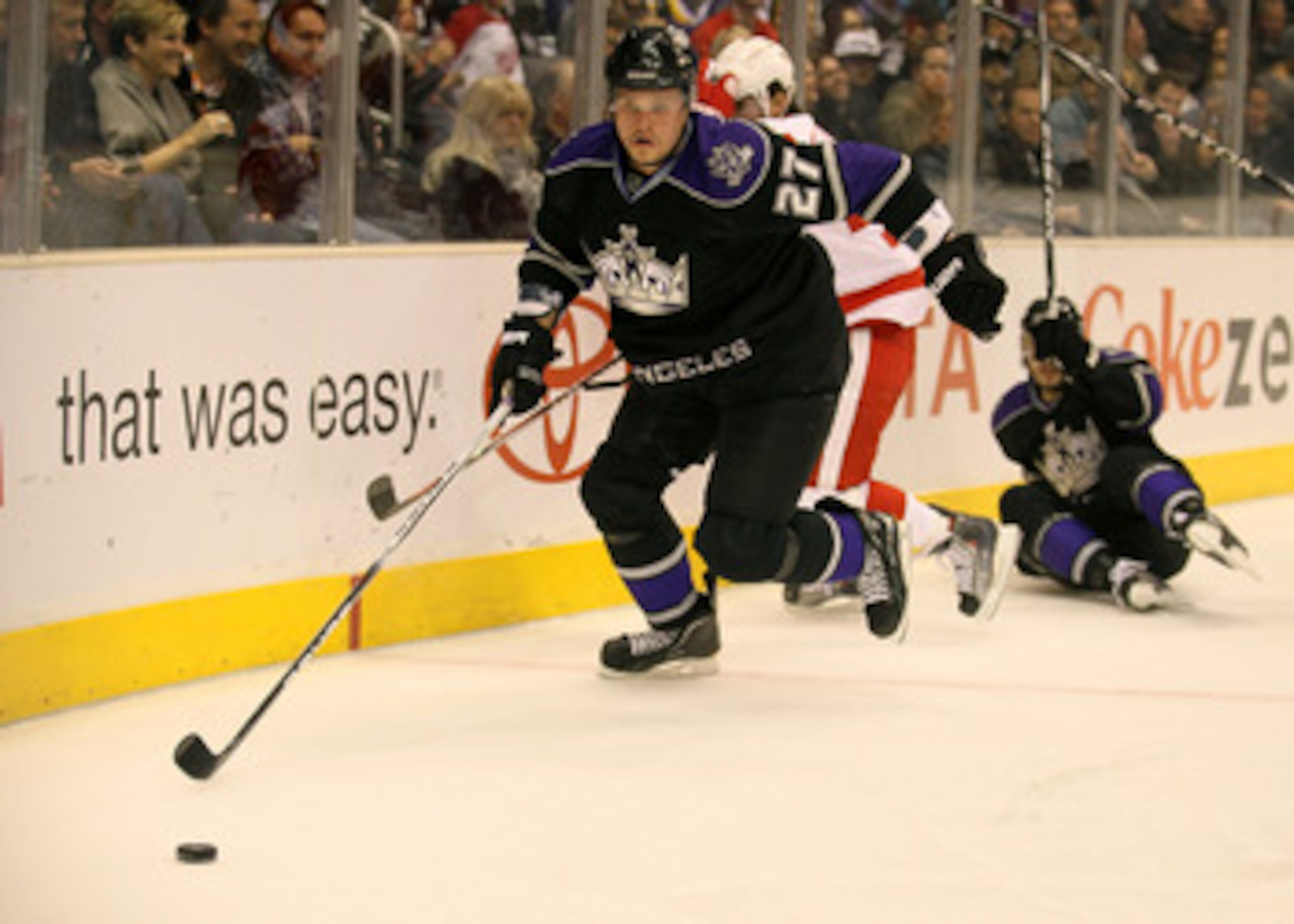 LOS ANGELES, CA - FEBRUARY 28:   Alexei Ponikarovsky #27 of the Los Angeles Kings chases the puck against the Detroit Red Wings at Staples Center on February 28, 2011 in Los Angeles, California.   The Red Wings won 7-4.  (Photo by Stephen Dunn/Getty Image