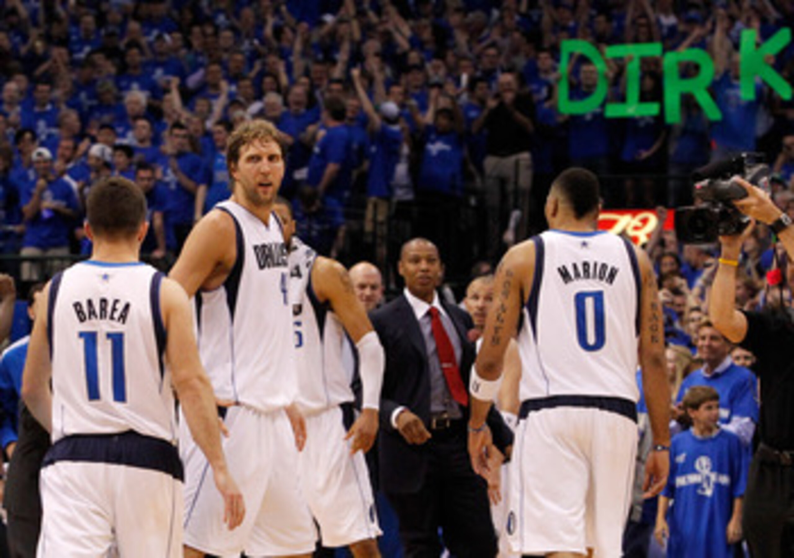 DALLAS, TX - MAY 25:  Dirk Nowitzki #41 of the Dallas Mavericks looks over at teammate Jose Juan Barea #11 late in the fourth quarter while taking on the Oklahoma City Thunder in Game Five of the Western Conference Finals during the 2011 NBA Playoffs at A