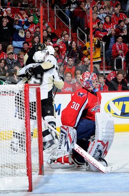 WASHINGTON, DC - DECEMBER 23:  Sidney Crosby #87 of the Pittsburgh Penguins celebrates with teammates after scoring in the first period against Michal Neuvirth #30 of the Washington Capitals  at the Verizon Center on December 23, 2010 in Washington DC.  (