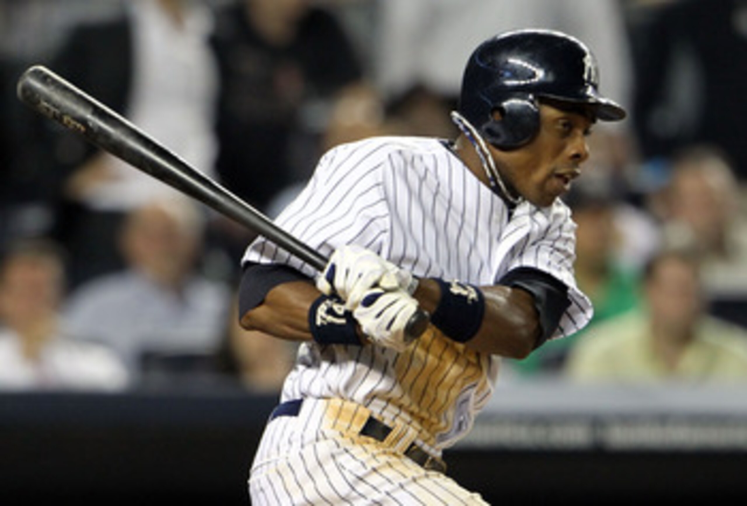 NEW YORK, NY - MAY 24:  Curtis Granderson #14 of the New York Yankees hits an RBI single in the ninth inning against the Toronto Blue Jays at Yankee Stadium on May 24, 2011 in the Bronx borough of New York City.  (Photo by Michael Heiman/Getty Images)