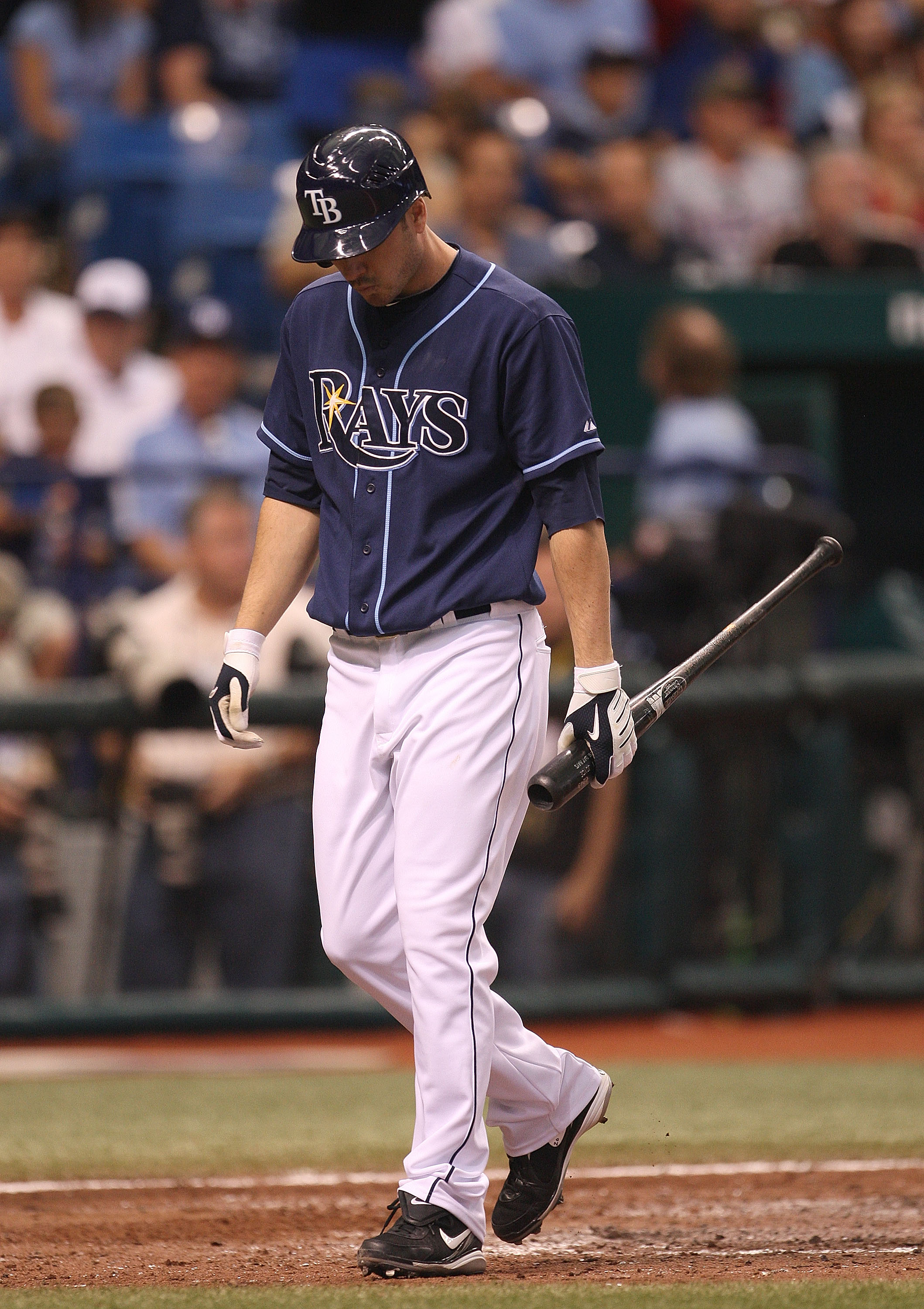 ST PETERSBURG, FL - OCTOBER 07: Matt Joyce #20 of the Tampa Bay Rays walks to the dugout after striking out during Game 2 of the ALDS against the Texas Rangers at Tropicana Field on October 7, 2010 in St. Petersburg, Florida.  (Photo by Mike Ehrmann/Getty
