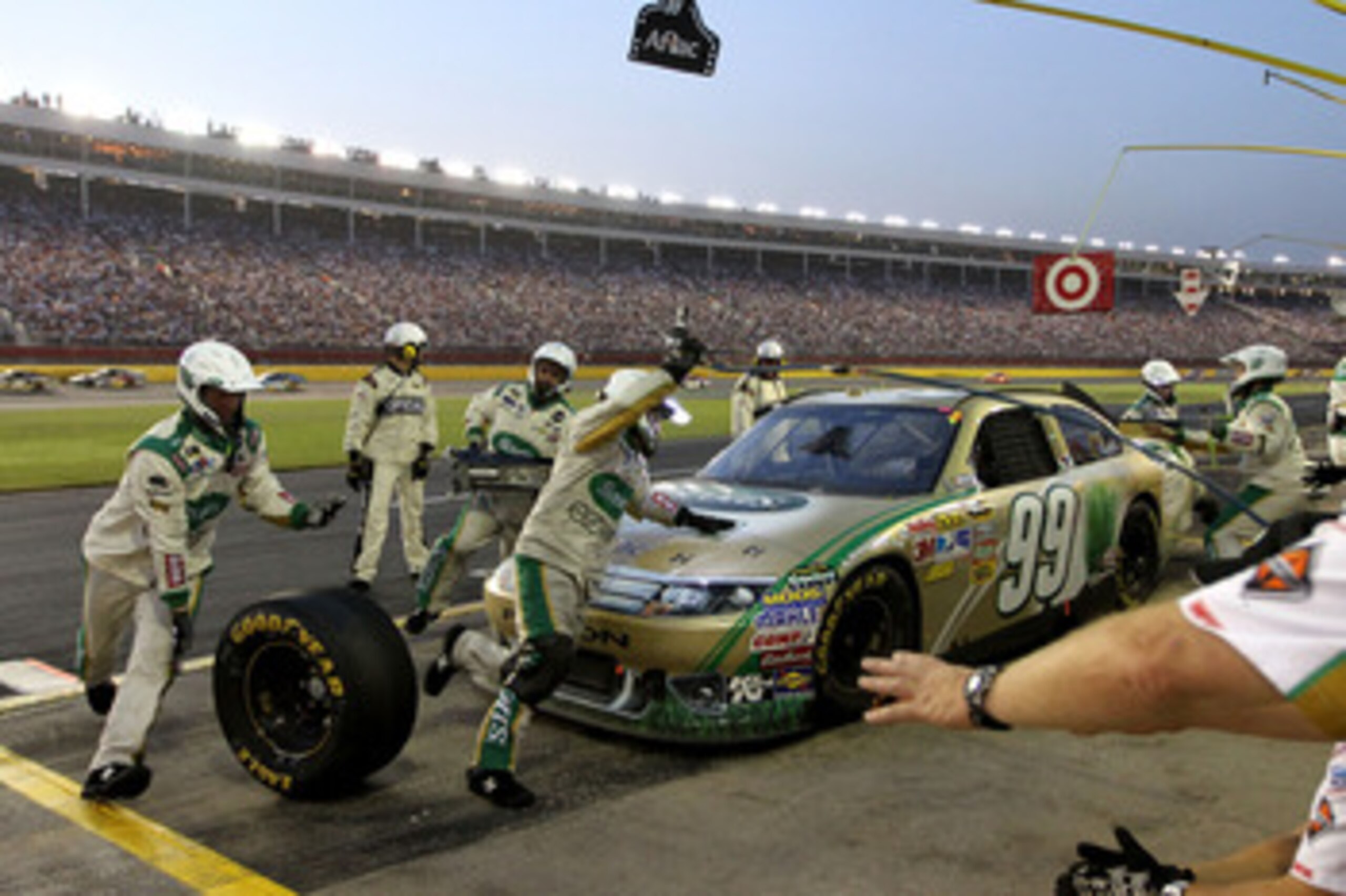CONCORD, NC - MAY 29: Carl Edwards, driver of the #99 Scotts EZ Seed Ford, pits during the NASCAR Sprint Cup Series Coca-Cola 600 at Charlotte Motor Speedway on May 29, 2011 in Concord, North Carolina.  (Photo by Jerry Markland/Getty Images for NASCAR)
