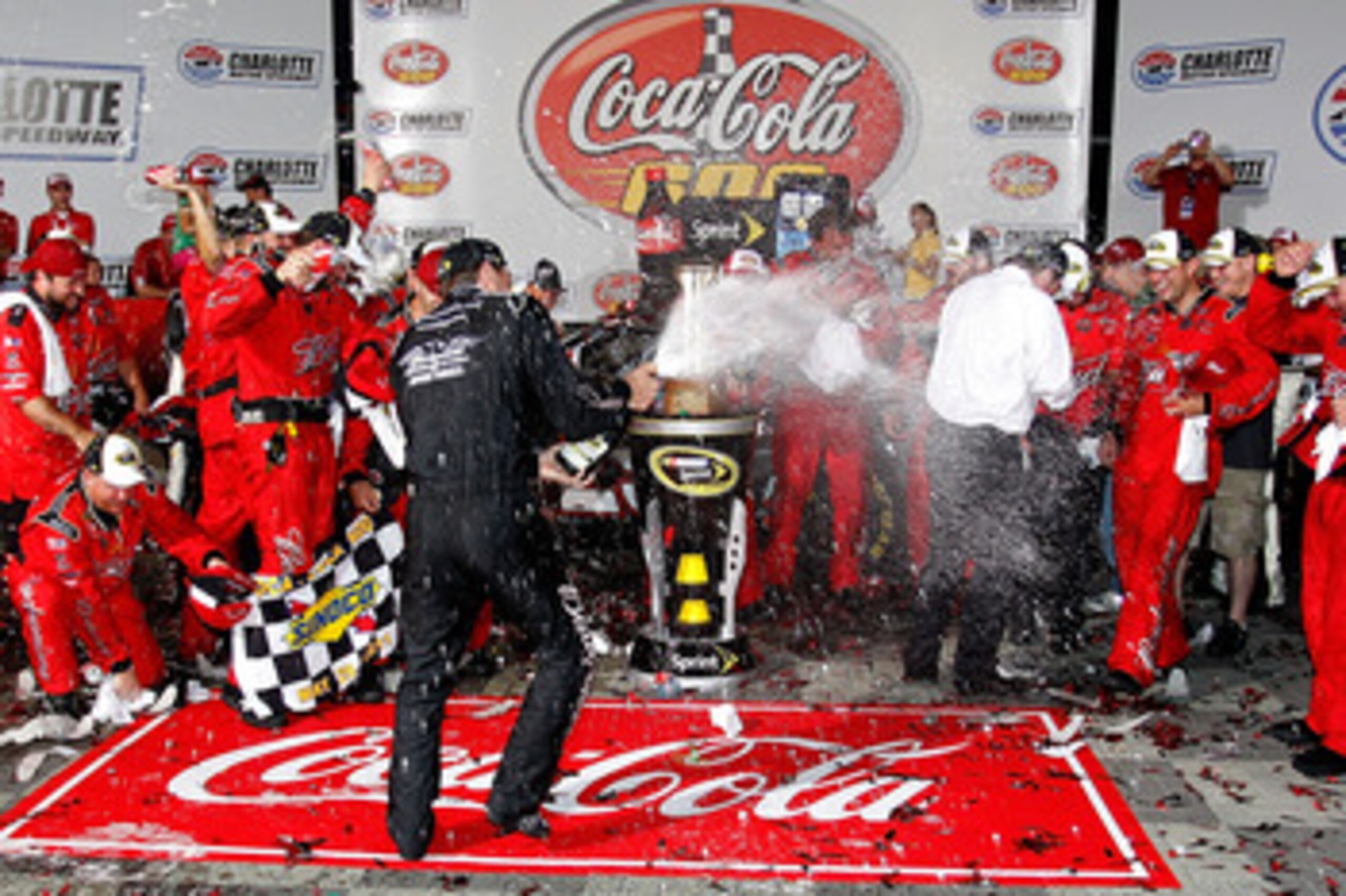 CONCORD, NC - MAY 29:  Kevin Harvick, driver of the #29 Budweiser Armed Forces Tribute Chevrolet, celebrates in Victory Lane after winning the NASCAR Sprint Cup Series Coca-Cola 600 at Charlotte Motor Speedway on May 29, 2011 in Concord, North Carolina.  