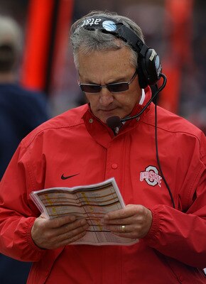 CHAMPAIGN, IL - OCTOBER 02: Head coach Jim Tressell of the Ohio State Buckeyes checks his play list during a game against the Illinois Fighting Illini at Memorial Stadium on October 2, 2010 in Champaign, Illinois. Ohio State defeated Illinois 24-13. (Phot CHAMPAIGN, IL - OCTOBER 02: Head coach Jim Tressell of the Ohio State Buckeyes checks his play list during a game against the Illinois Fighting Illini at Memorial Stadium on October 2, 2010 in Champaign, Illinois. Ohio State defeated Illinois 24-13. (Phot
