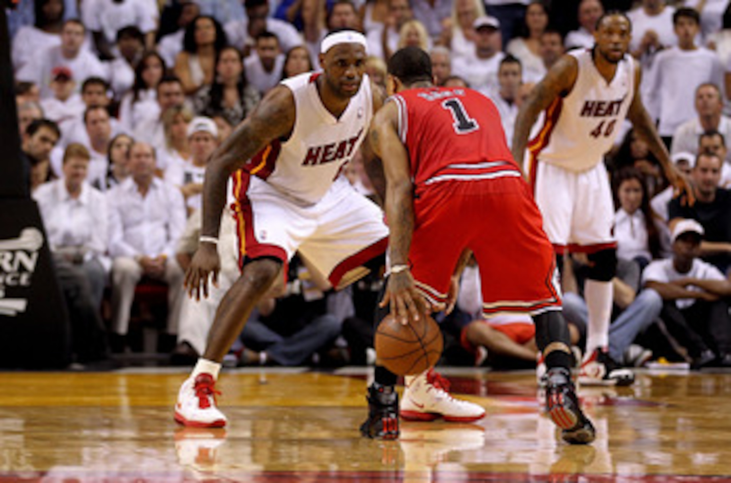 MIAMI, FL - MAY 24:  LeBron James #6 of the Miami Heat defends Derrick Rose #1 of the Chicago Bulls in Game Four of the Eastern Conference Finals during the 2011 NBA Playoffs on May 24, 2011 at American Airlines Arena in Miami, Florida. The Heat won 101-9