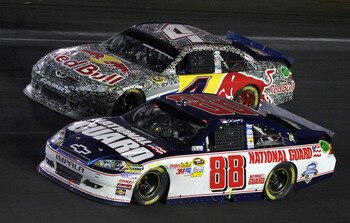 CONCORD, NC - MAY 29:  Dale Earnhardt Jr., driver of the #88 National Guard/Amp Energy Chevrolet, races side by side with Kasey Kahne, driver of the #4 Red Bull Toyota, during the NASCAR Sprint Cup Series Coca-Cola 600 at Charlotte Motor Speedway on May 2