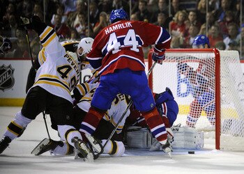 MONTREAL, CANADA - APRIL 26:  Zdeno Chara #33;Rich Peverley #49 and David Krejci #46 of the Boston Bruins battle for a loose puck in the crease against Roman Hamrlik #44 and Carey Price #31 of the Montreal Canadiens in Game Six of the Eastern Conference Q