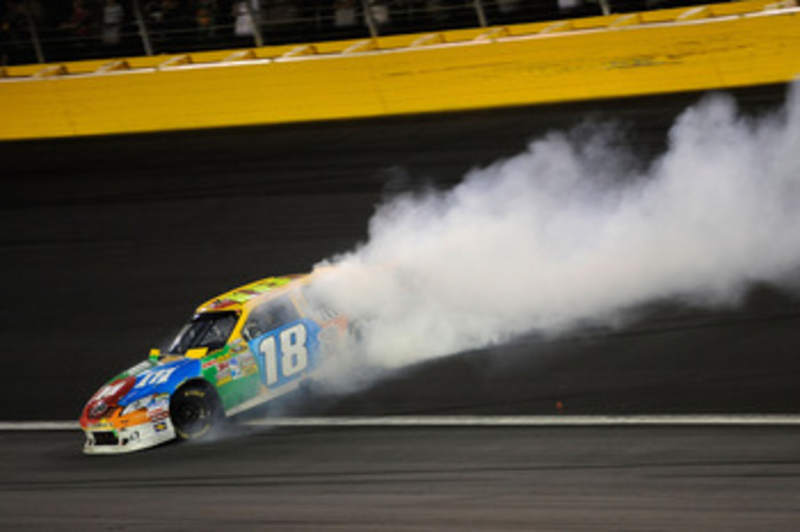 CONCORD, NC - MAY 29:  Kyle Busch, driver of the #18 M&M's Toyota, spins out after an incident in the NASCAR Sprint Cup Series Coca-Cola 600 at Charlotte Motor Speedway on May 29, 2011 in Concord, North Carolina.  (Photo by John Harrelson/Getty Images for