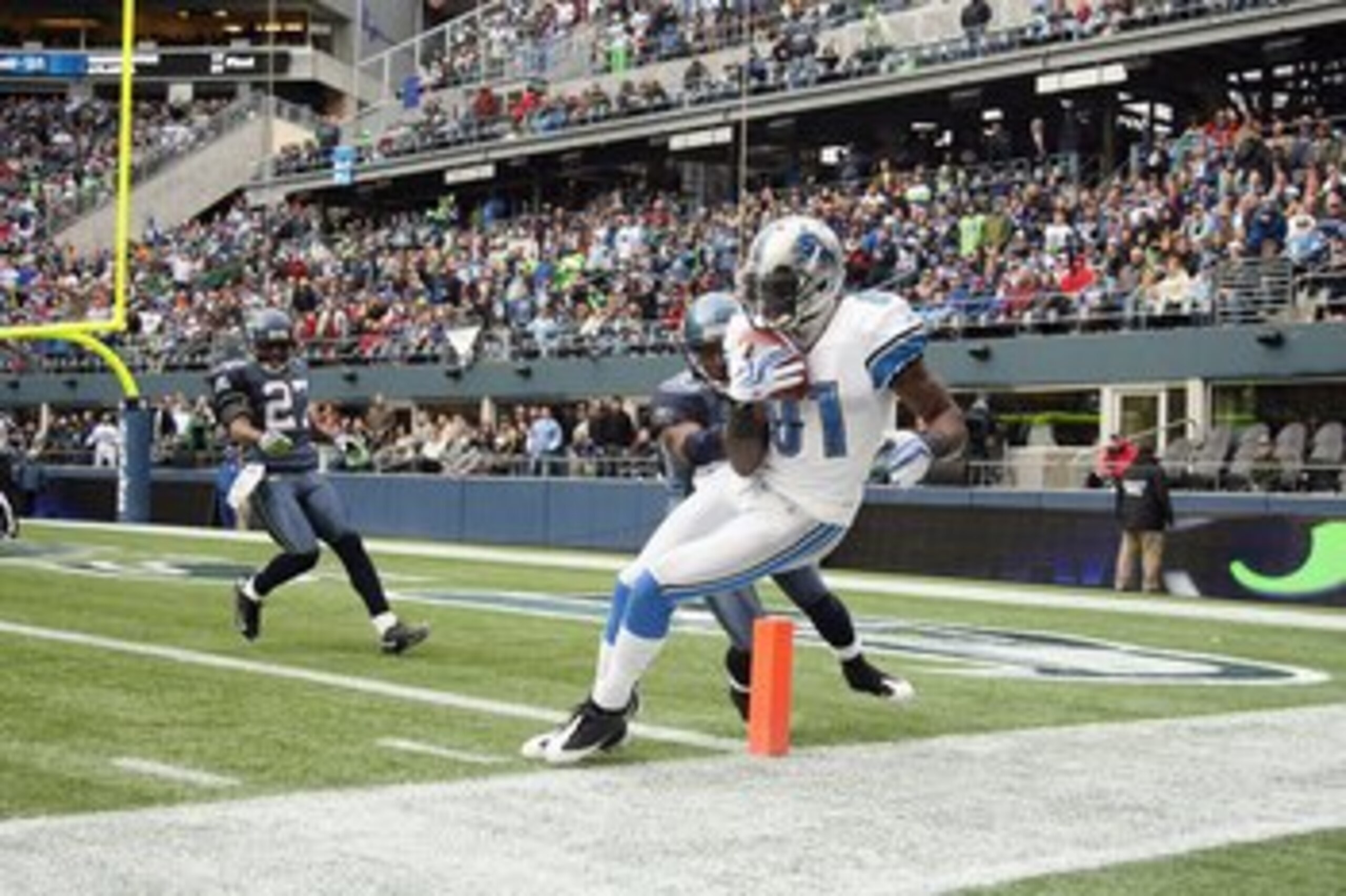 SEATTLE - NOVEMBER 08: Wide receiver Calvin Johnson #81 of the Detroit Lions makes a catch at the one-yard line against Marcus Trufant #23 of the Seattle Seahawks on November 8, 2009 at Qwest Field in Seattle, Washington. Johnson was ruled out of bounds o