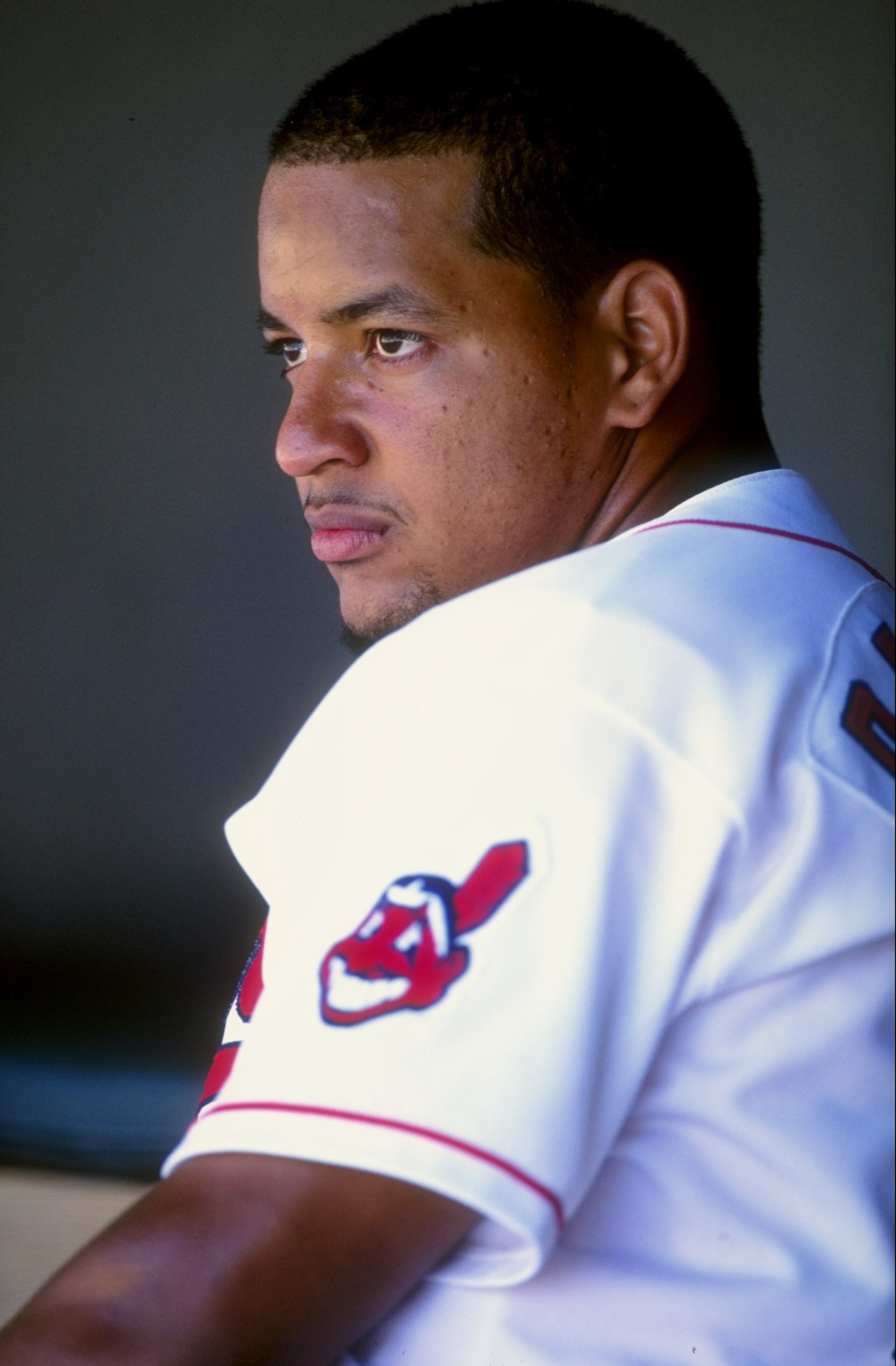 11 Jul 1998:  Manny Ramirez #24 of the Cleveland Indians looking on from the dug out during the game against the Minnesota Twins at Jacobs Field in Cleveland, Ohio. The Indians defeated the Twins 12-2.