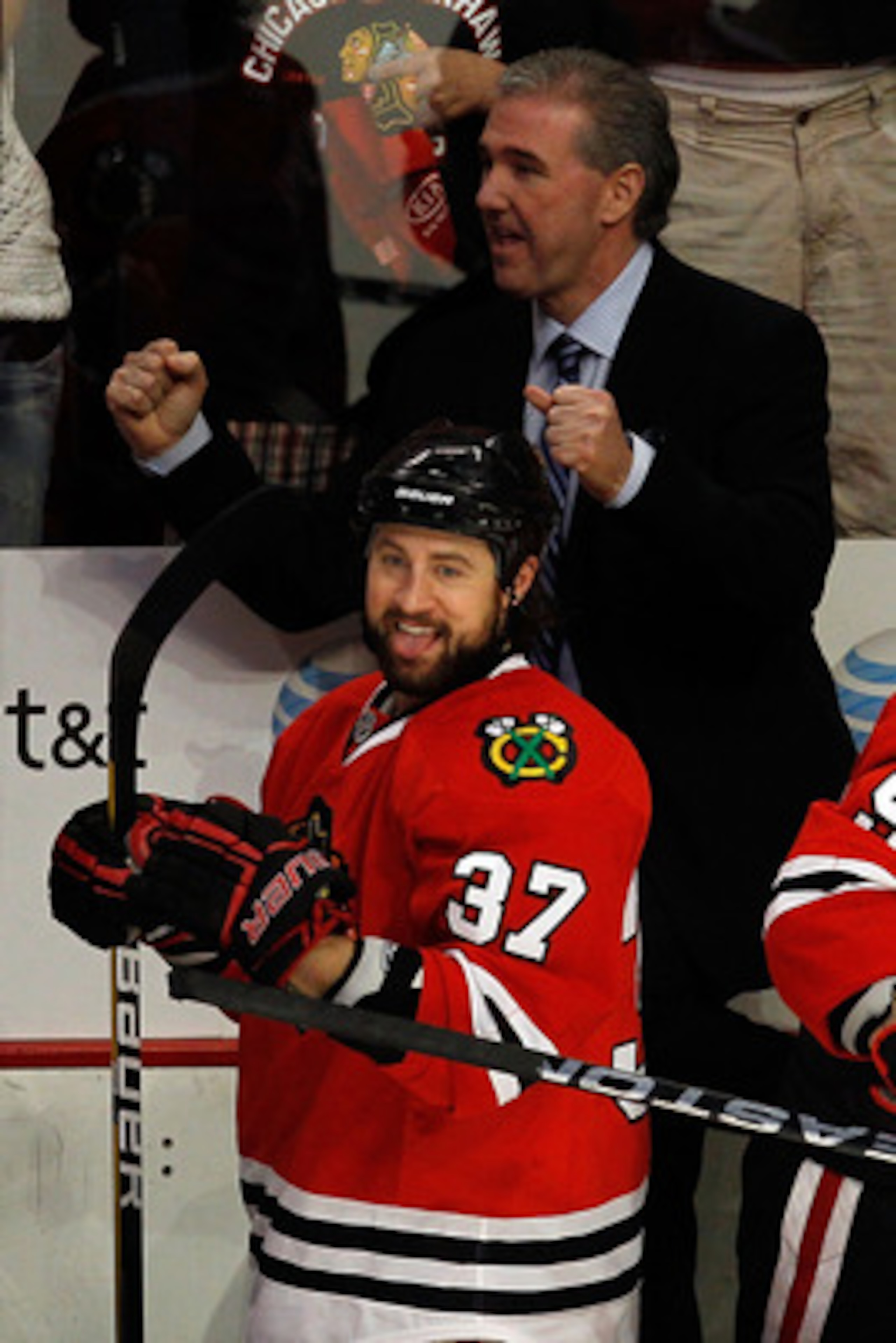 CHICAGO - MAY 23: Adam Burish #37 and assistant coach Mike Haviland of the Chicago Blackhawks celebrate a late third period goal against the San Jose Sharks as the Blackhawks advance to the Stanley Cup after winning Game Four of the Western Conference Fi CHICAGO - MAY 23: Adam Burish #37 and assistant coach Mike Haviland of the Chicago Blackhawks celebrate a late third period goal against the San Jose Sharks as the Blackhawks advance to the Stanley Cup after winning Game Four of the Western Conference Fi
