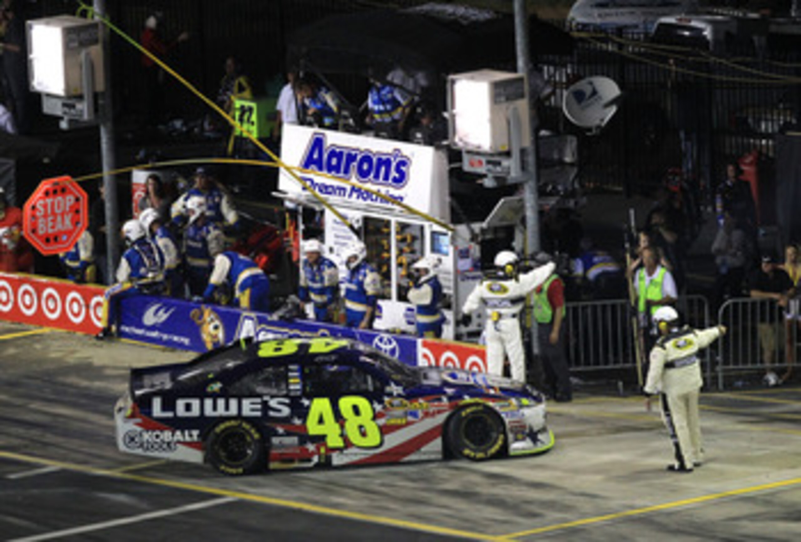 CONCORD, NC - MAY 29:  Jimmie Johnson drives the #48 Lowe's Summer Salute Chevrolet off pit road after an incident in the NASCAR Sprint Cup Series Coca-Cola 600 at Charlotte Motor Speedway on May 29, 2011 in Concord, North Carolina.  (Photo by Streeter Le
