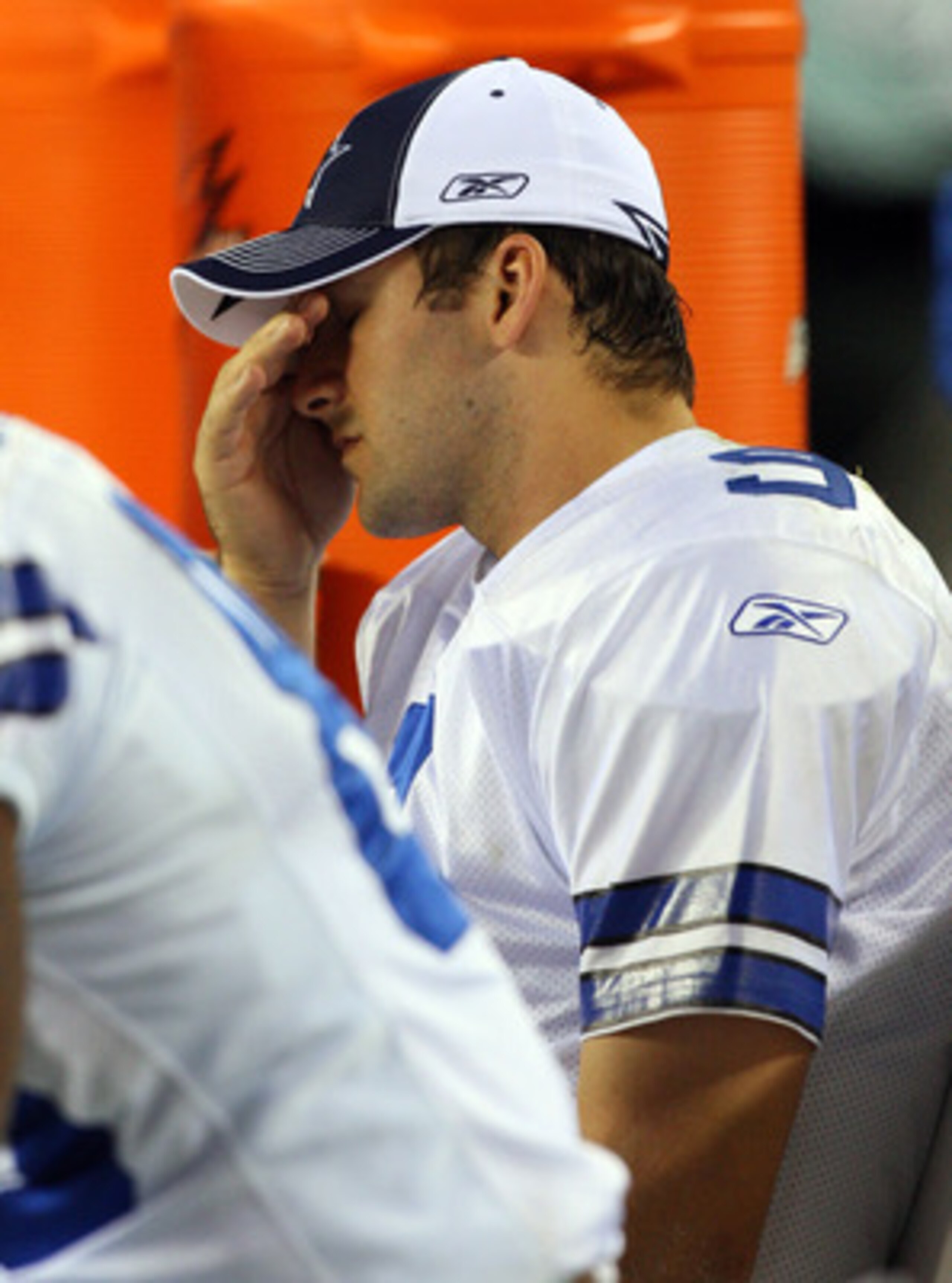 PHILADELPHIA - DECEMBER 28:  Tony Romo #9 of the Dallas Cowboys sits on the bench late in the game against the Philadelphia Eagles on December 28, 2008 at Lincoln Financial Field in Philadelphia, Pennsylvania. The Eagles defeated the Cowboys 44-6.  (Photo