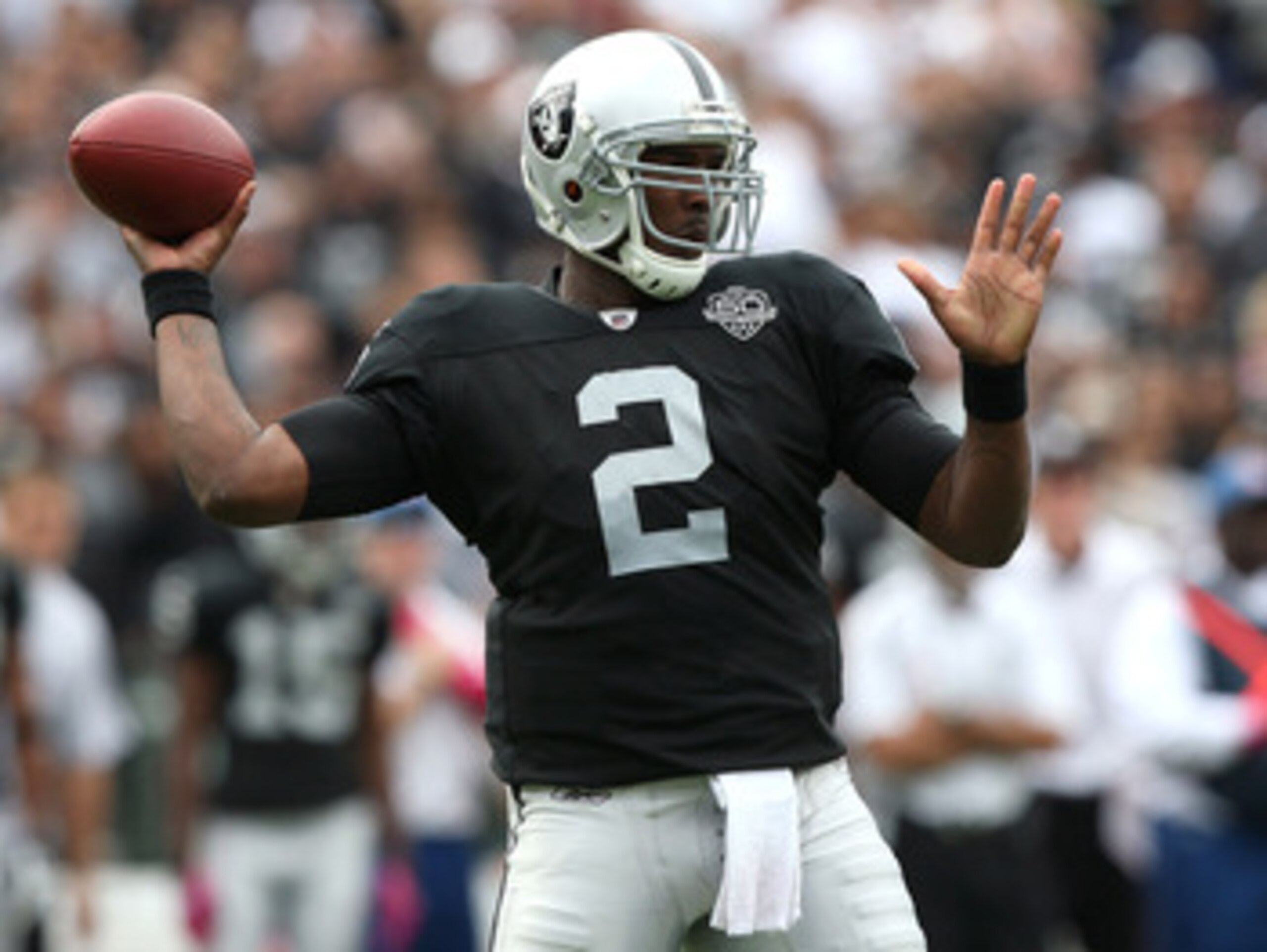 OAKLAND, CA - OCTOBER 18:  JaMarcus Russell #2 of the Oakland Raiders passes against the Philadelphia Eagles during an NFL game at the Oakland-Alameda County Coliseum on October 18, 2009 in Oakland, California.  (Photo by Jed Jacobsohn/Getty Images)