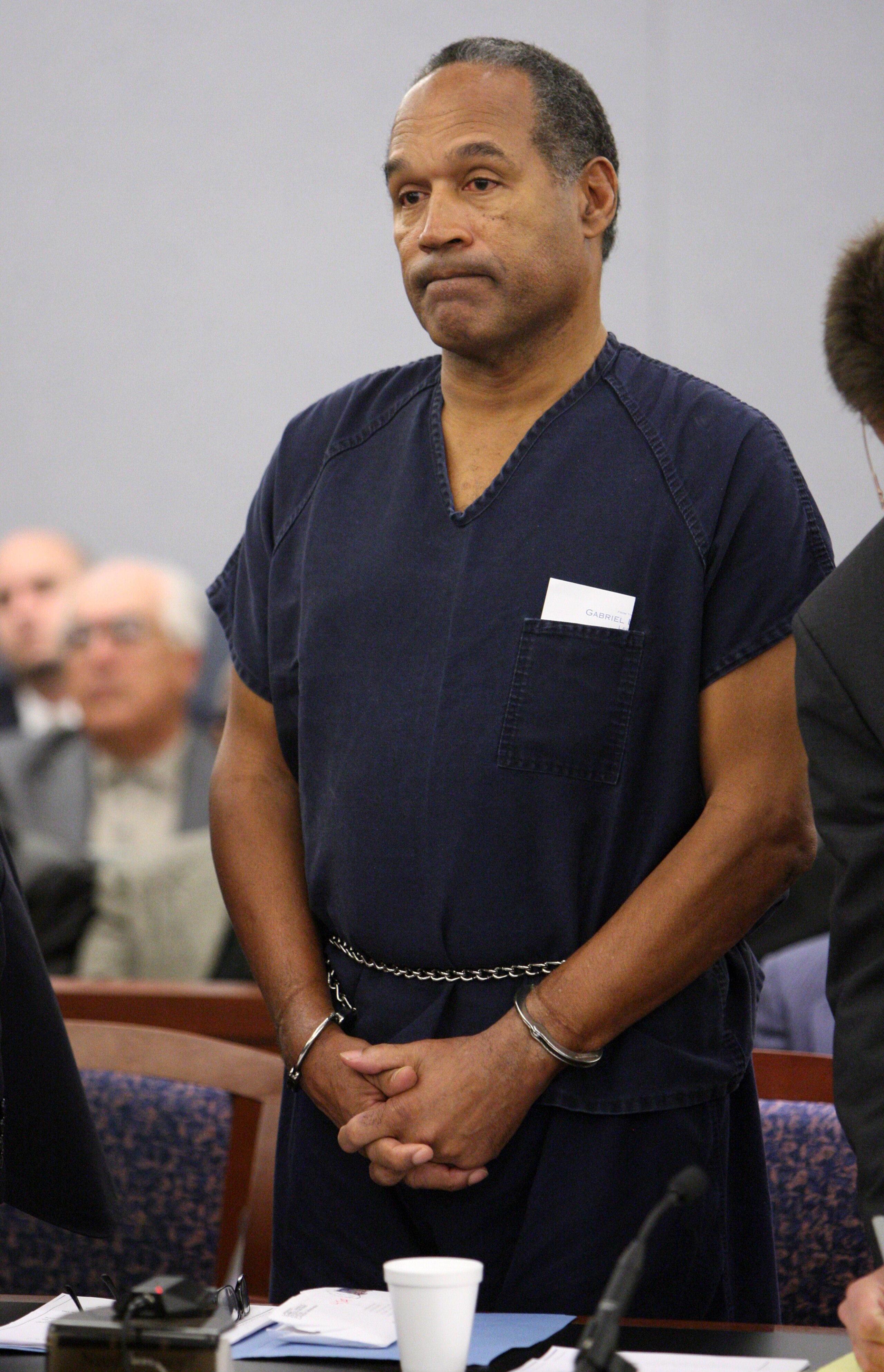 LAS VEGAS - DECEMBER 5: OJ Simpson listens as District Court Judge Jackie Glass reads his sentence at the Clark County Regional Justice Center December 5, 2008 in Las Vegas, Nevada. Simpson and co-defendant Clarence 'C.J.' Stewart were sentenced on 12 c LAS VEGAS - DECEMBER 5: OJ Simpson listens as District Court Judge Jackie Glass reads his sentence at the Clark County Regional Justice Center December 5, 2008 in Las Vegas, Nevada. Simpson and co-defendant Clarence 'C.J.' Stewart were sentenced on 12 c