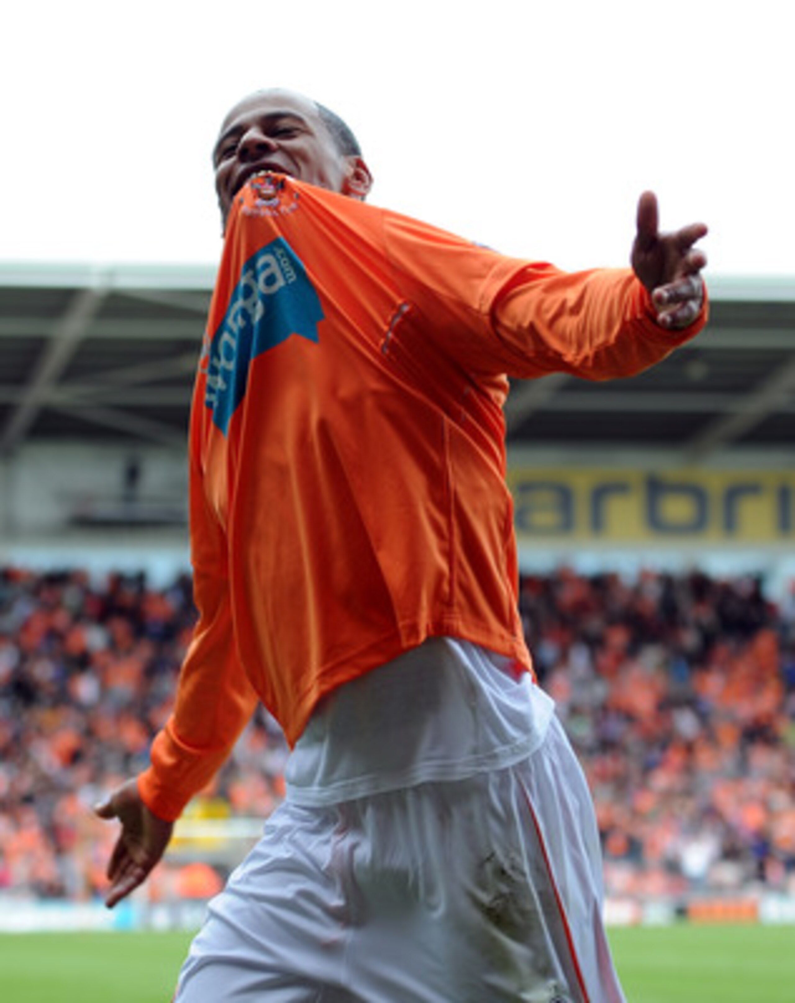 BLACKPOOL, ENGLAND - MAY 14:  DJ Campbell of Blackpool celebrates scoring his side's third goal during the Barclays Premier League match between Blackpool and Bolton Wanderers at Bloomfield Road on May 14, 2011 in Blackpool, England.  (Photo by Chris Brun