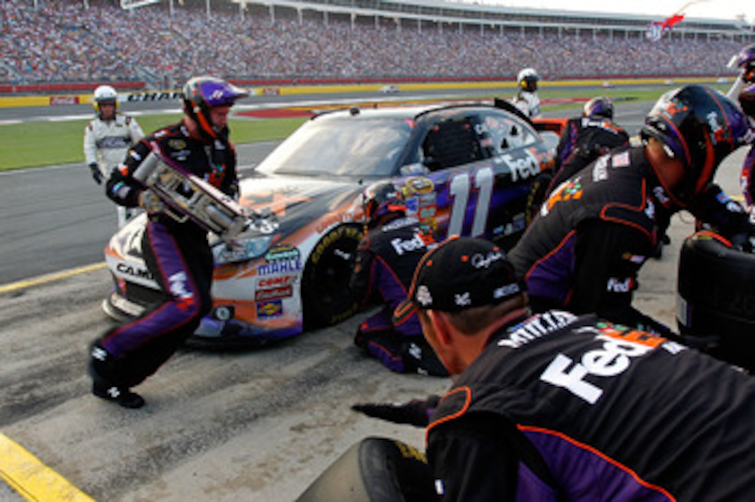 CONCORD, NC - MAY 29: Denny Hamlin, driver of the #11 FedEx Express Toyota, pits during the NASCAR Sprint Cup Series Coca-Cola 600 at Charlotte Motor Speedway on May 29, 2011 in Concord, North Carolina.  (Photo by Geoff Burke/Getty Images for NASCAR)