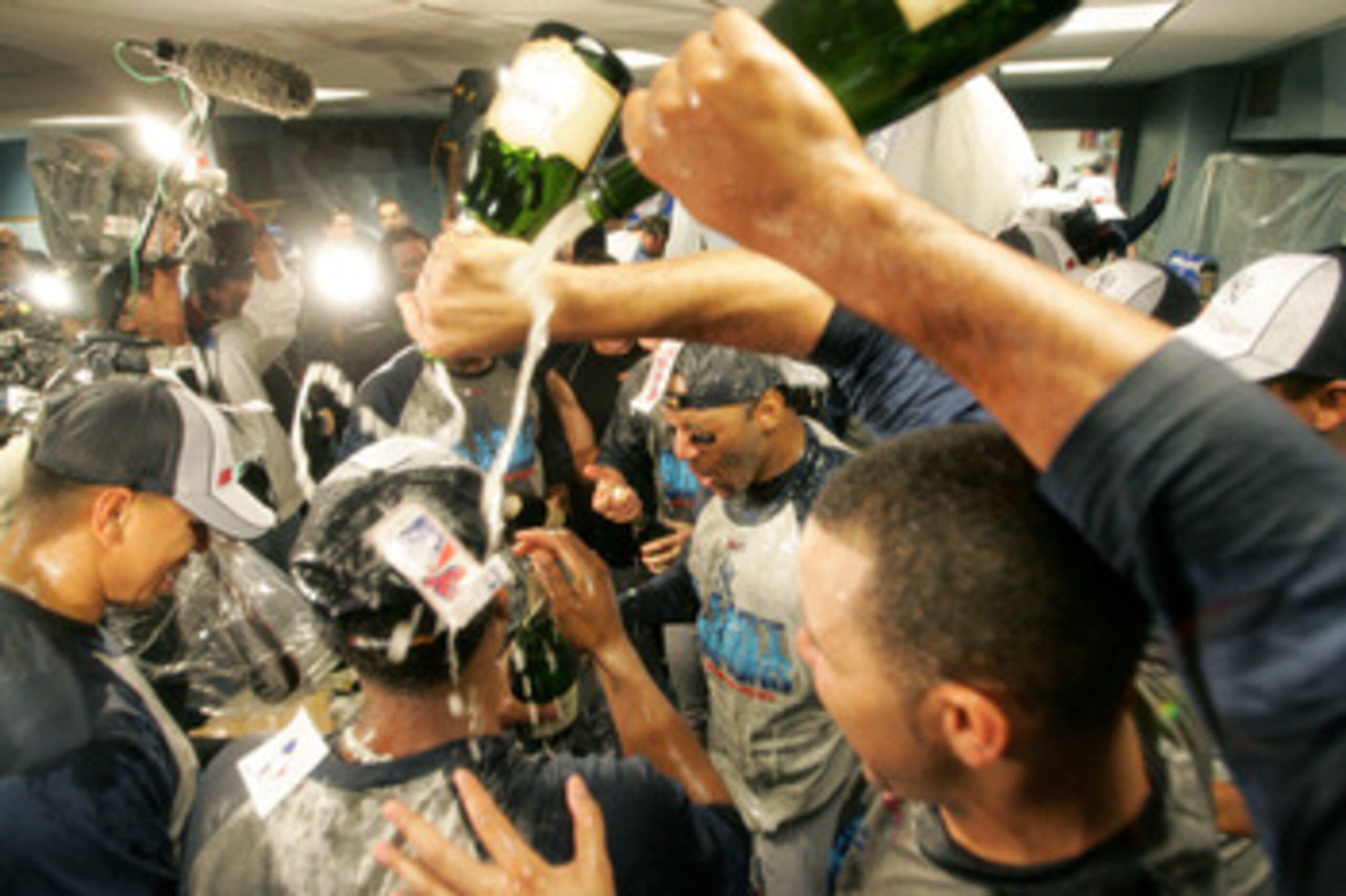 BOSTON - OCTOBER 01:  The New York Yankees celebrate in the locker room after clinching the AL East division title by defeating the Boston Red Sox at Fenway Park on October 1, 2005 in Boston, Massachusetts. The Yankees won the game 8-4.  (Photo by Jessica