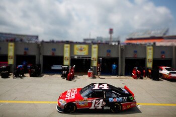 CHARLOTTE, NC - MAY 28:  (***EDITORS NOTE*** - THIS DIGITAL IMAGE WAS CREATED WITH THE USE OF VARIABLE FOCAL PLANE LENS) Tony Stewart drives the #14 Office Depot/Mobil 1 Chevrolet through the garage area during practice for the NASCAR Sprint Cup Series Co