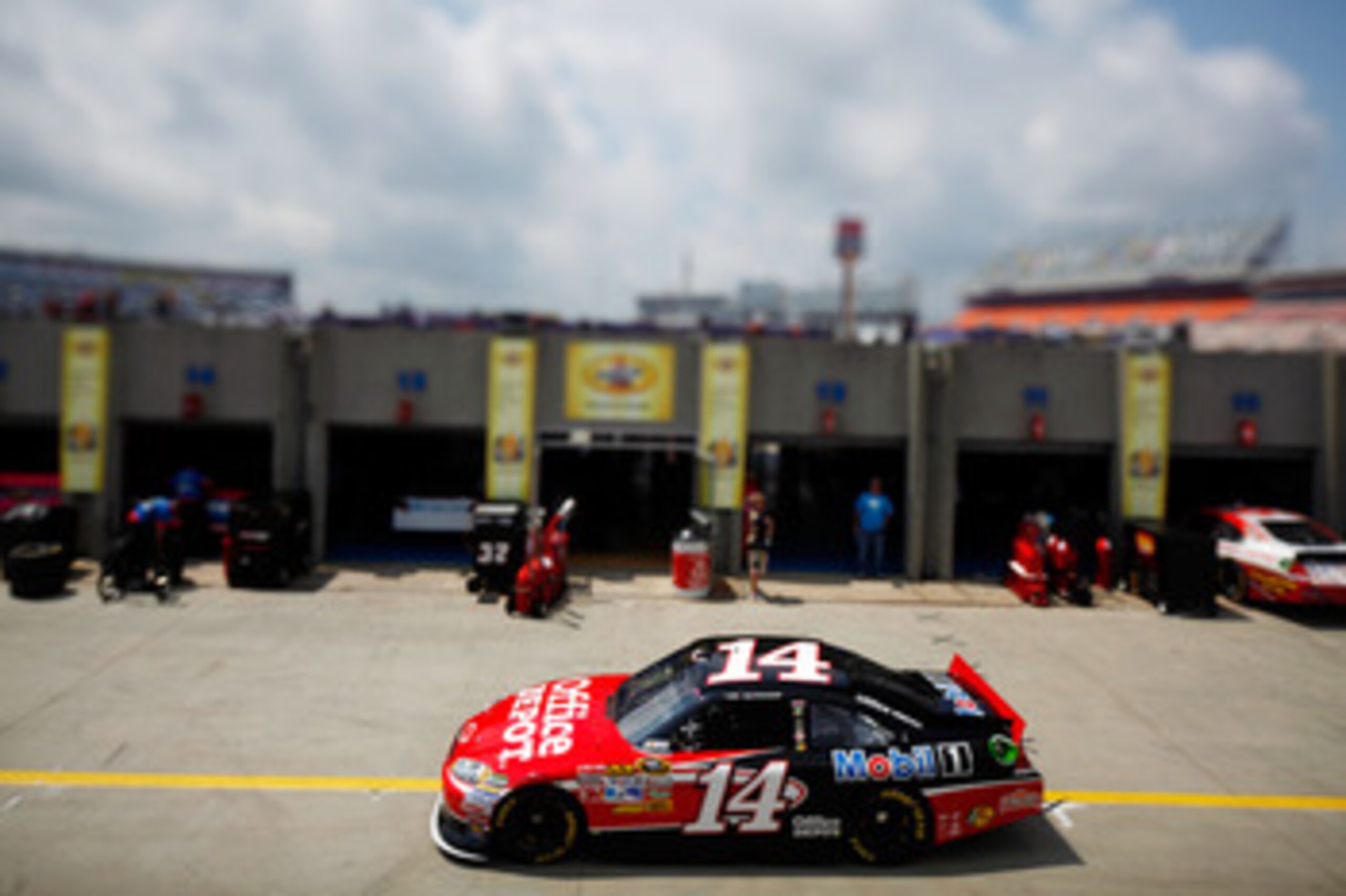 CHARLOTTE, NC - MAY 28:  (***EDITORS NOTE*** - THIS DIGITAL IMAGE WAS CREATED WITH THE USE OF VARIABLE FOCAL PLANE LENS) Tony Stewart drives the #14 Office Depot/Mobil 1 Chevrolet through the garage area during practice for the NASCAR Sprint Cup Series Co